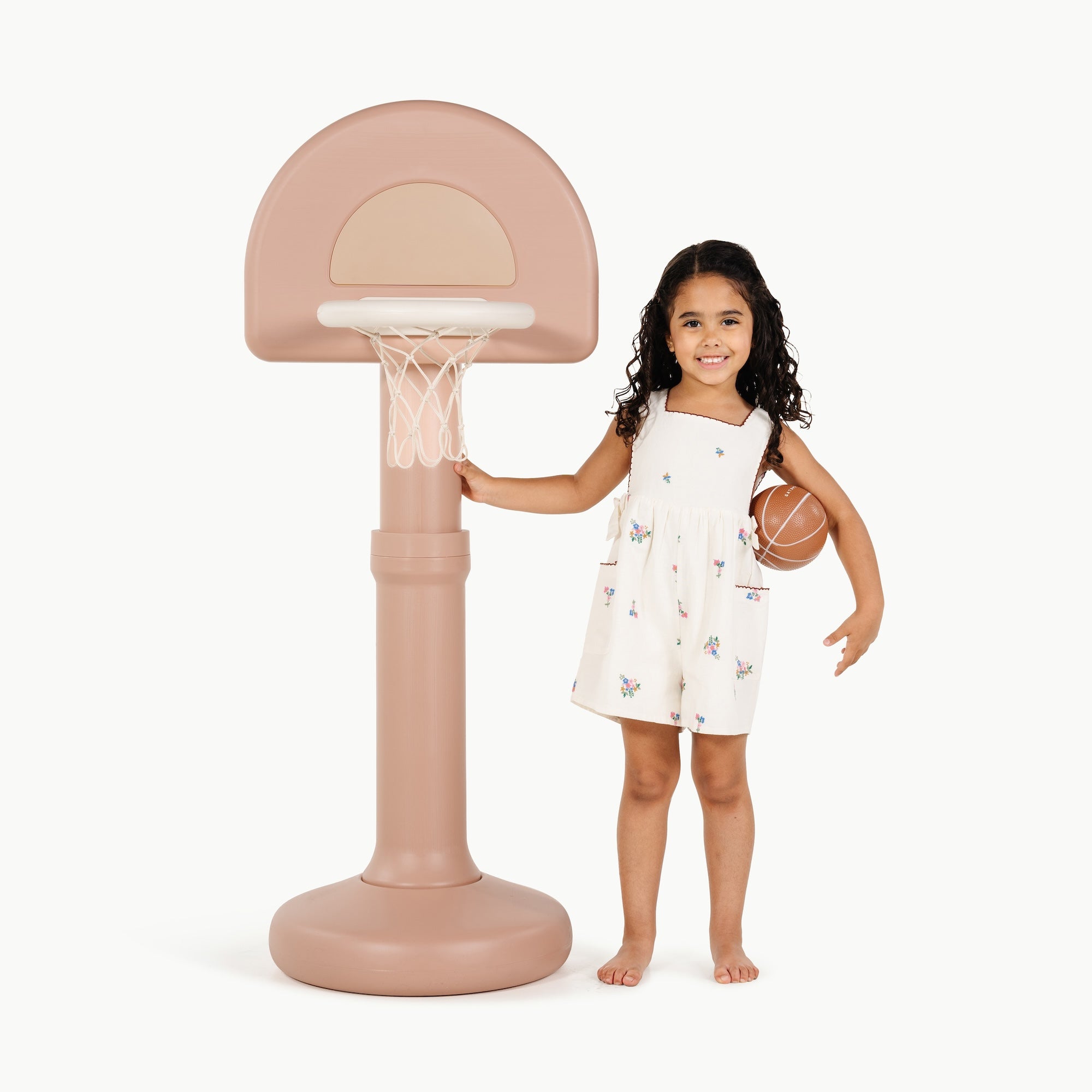 Tulle@Toddler using a basketball hoop to practice coordination and movement