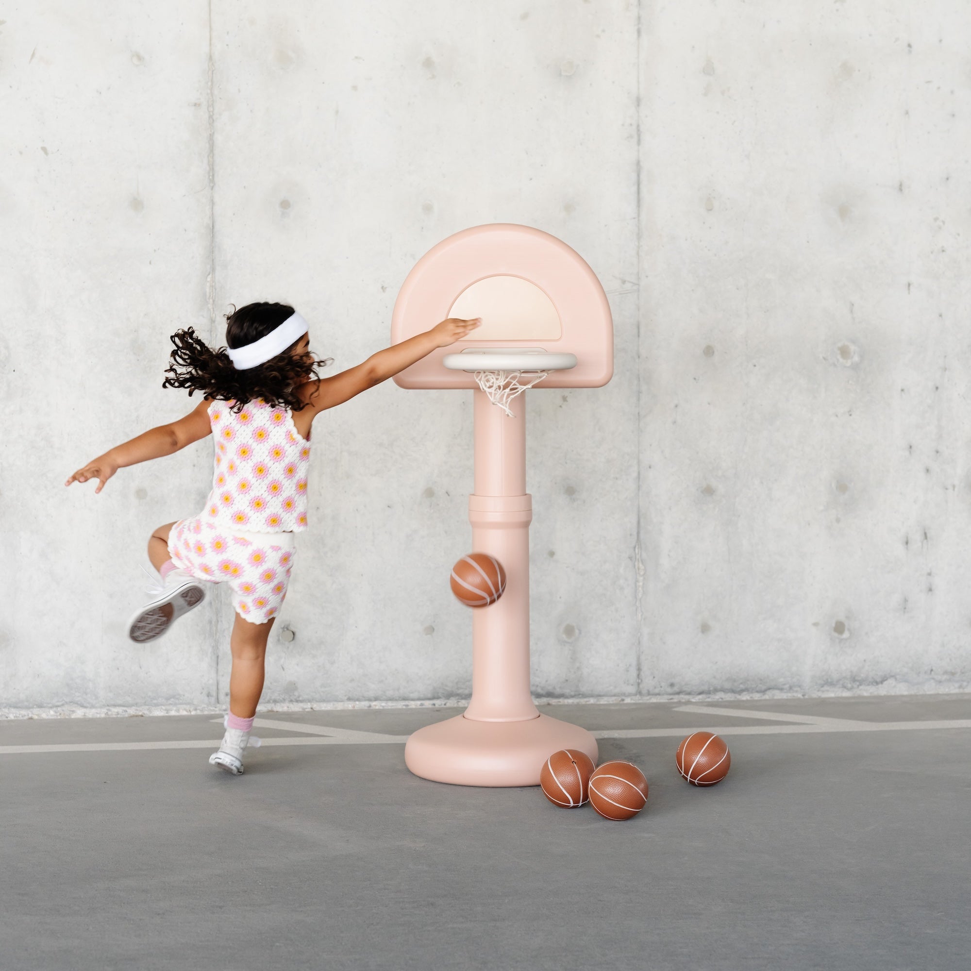 Tulle@Toddler using a basketball hoop to practice coordination and movement