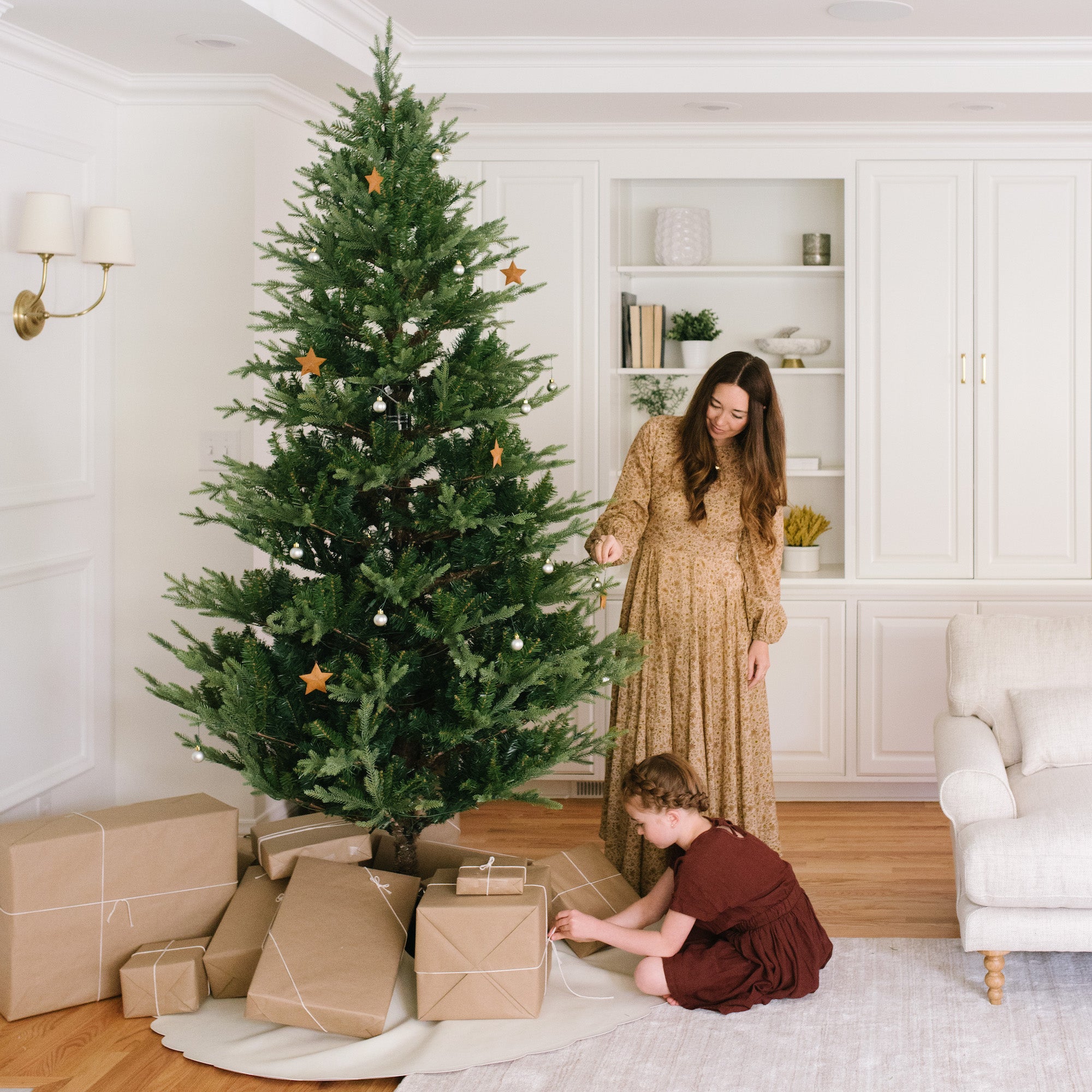 Ivory (on sale)@Gathre Tree Skirt under a tree in a home with people around it