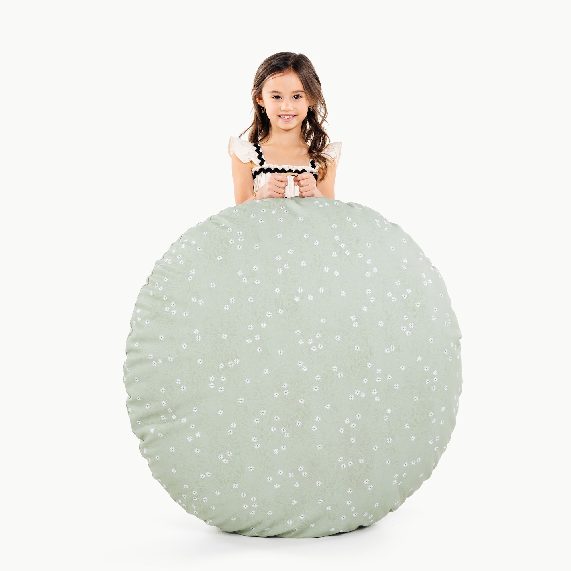 Flora (on sale)/ Circle@little girl holding a floor cushion