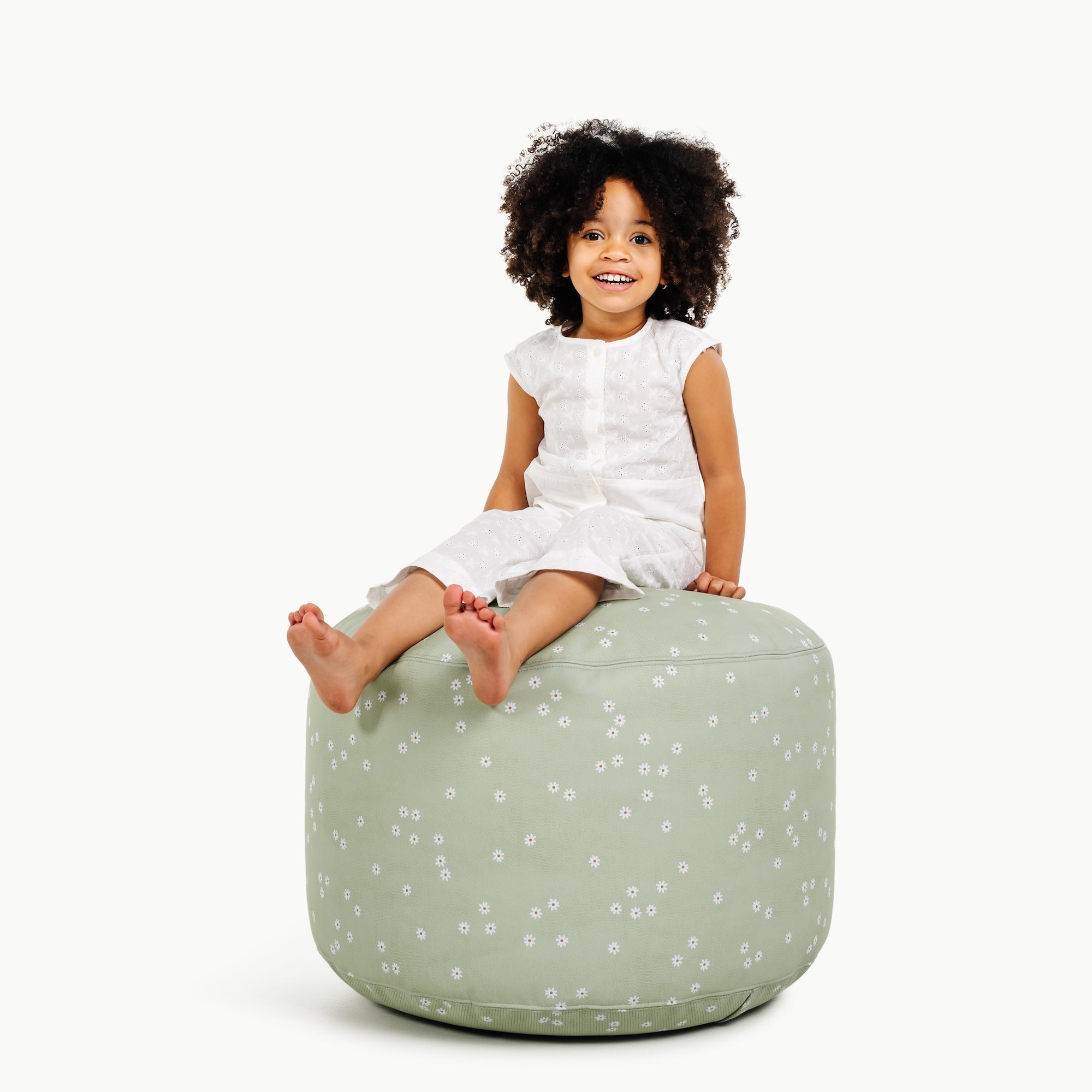 Flora (on sale)@little girl sitting on pouf