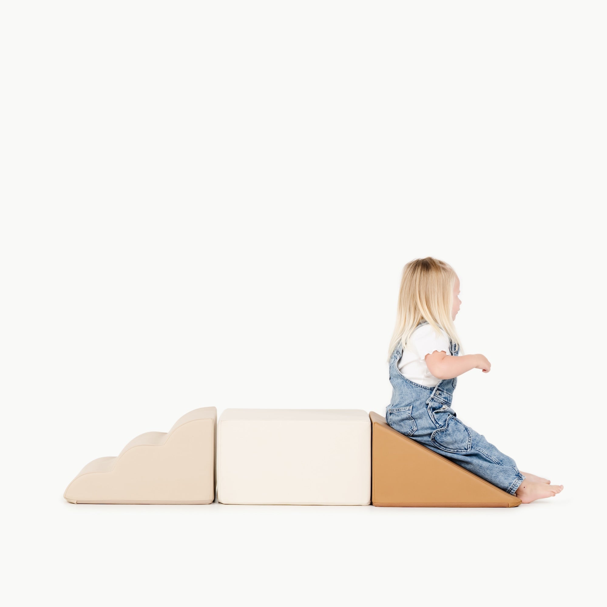 kid playing on the mini climber playset