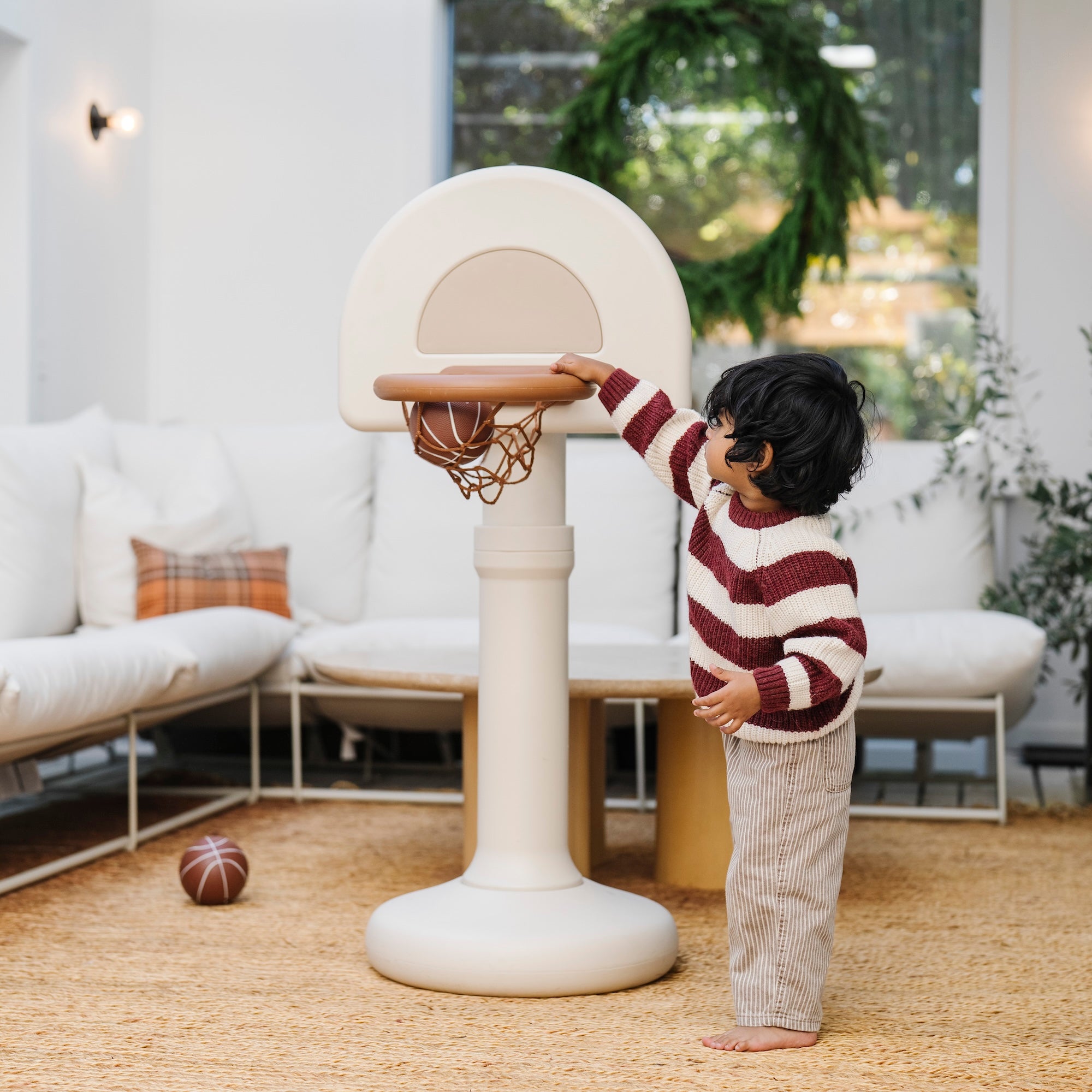 Ivory@Modern basketball hoop for toddlers styled in a home play space