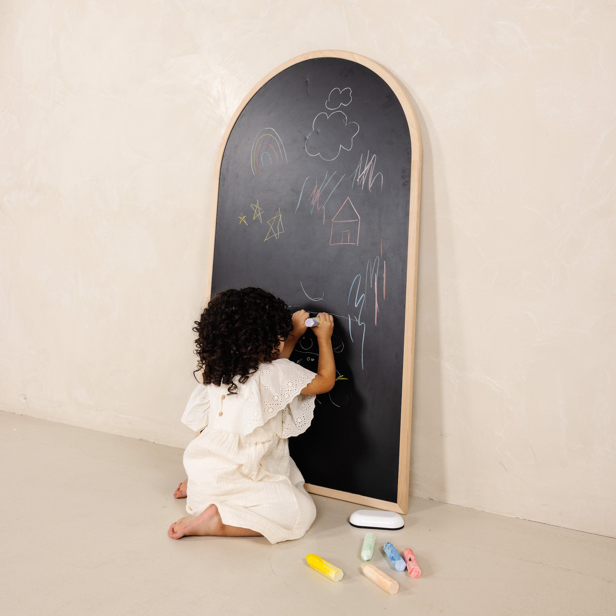 Beech@Child using a kids chalkboard for drawing and magnetic play at home