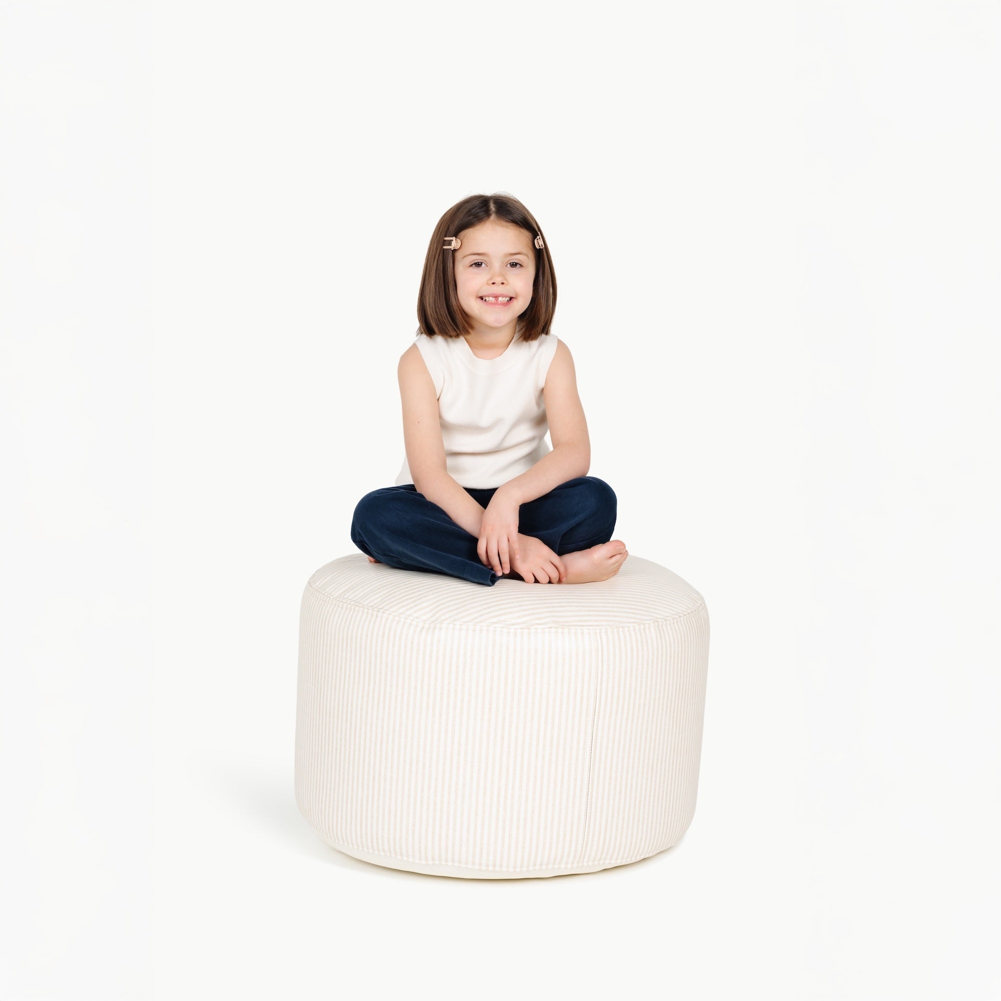 Pinstripe (on sale)@little girl sitting on a circle pouf