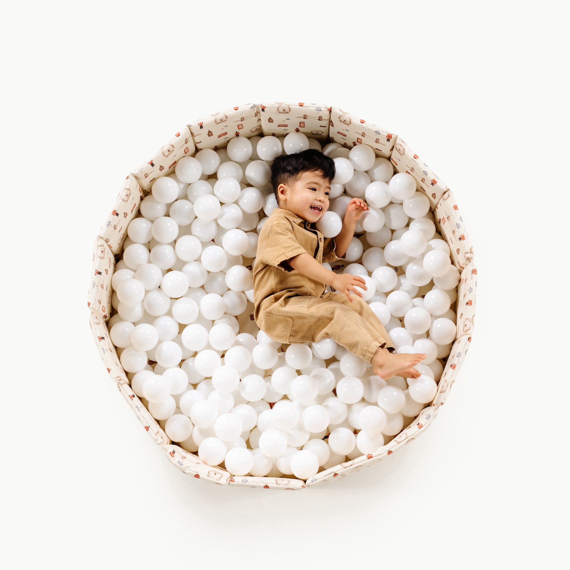 London (on sale)@Child playing in a soft ball pit designed for babies and toddlers