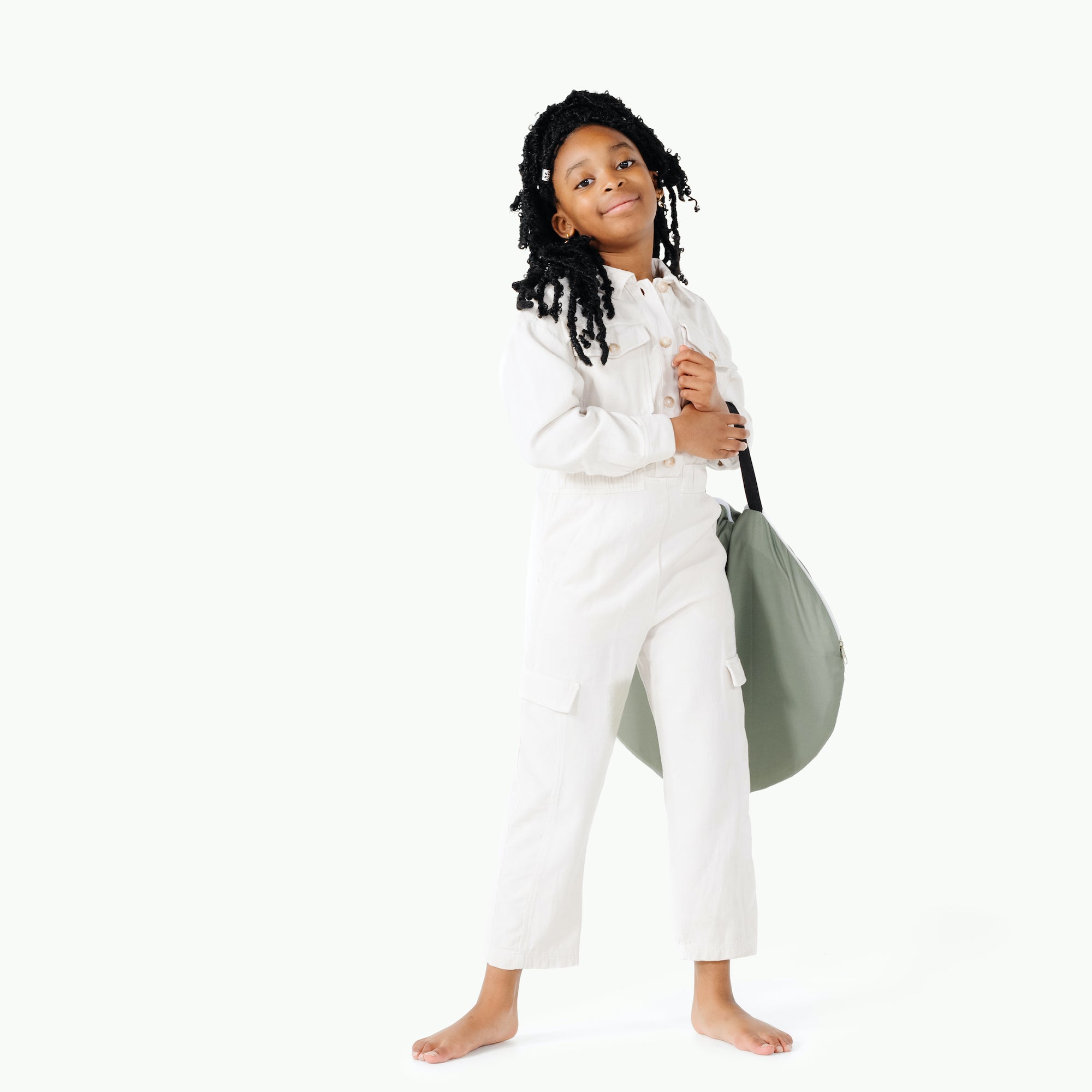 Seagrass (on sale)@kids holding the rollic by gathre 3-in-1 playroom bundle folded up
