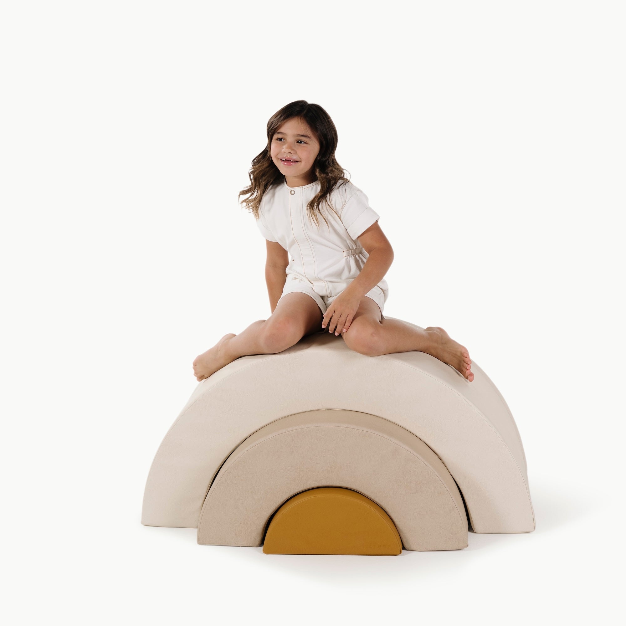 Ivory • Millet • Saffron (on sale)@little girl playing on an arc playset