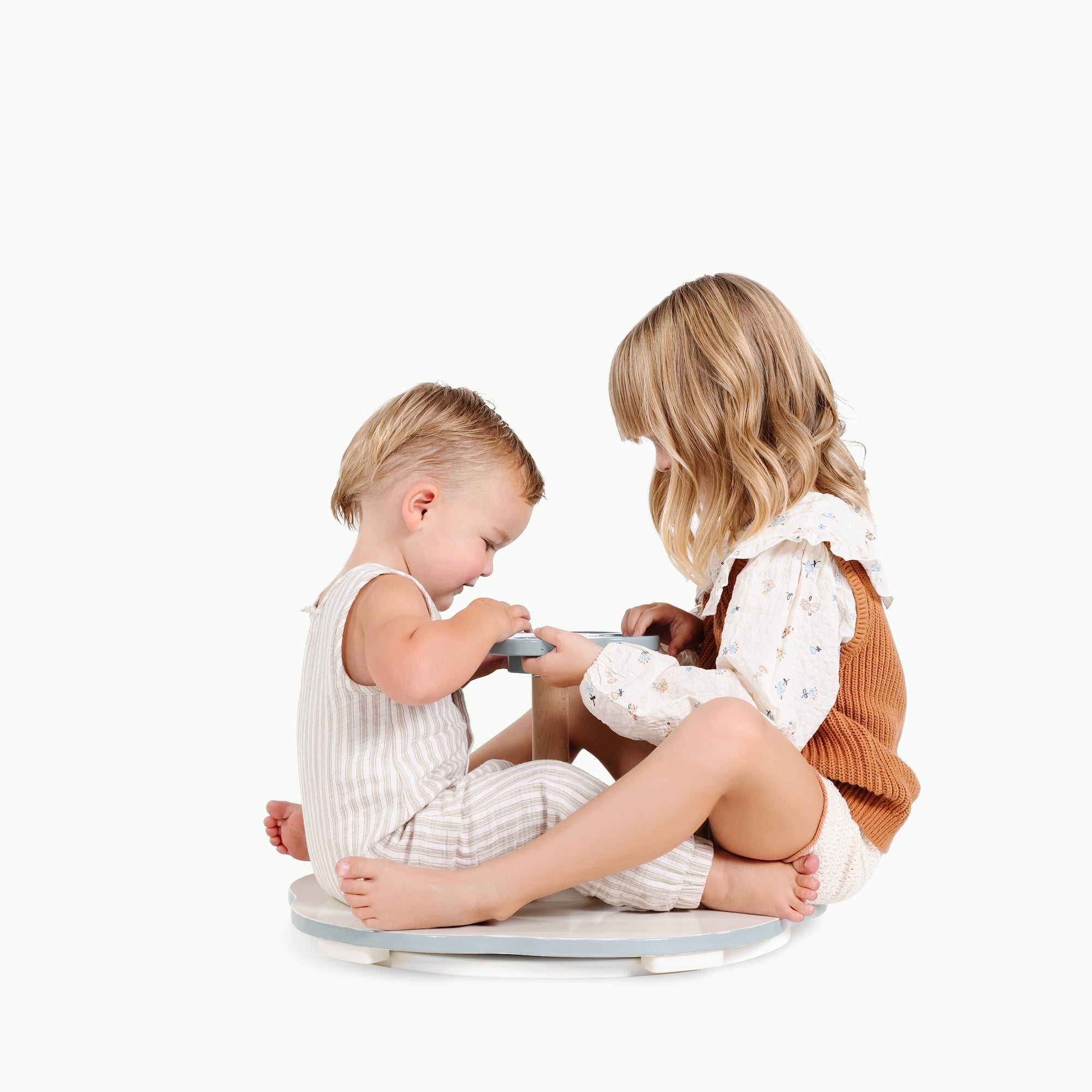 Harbor (on sale)@Toddlers using a sit and spin toy to practice balance and coordination