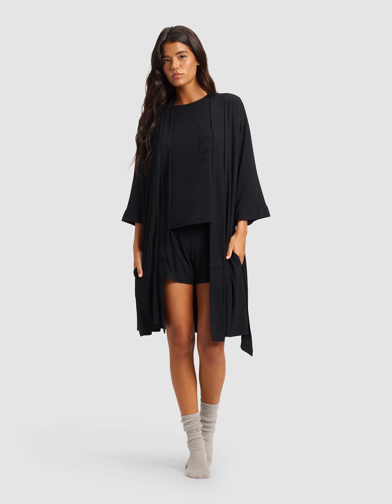 Black@woman wearing a black cozy earth robe