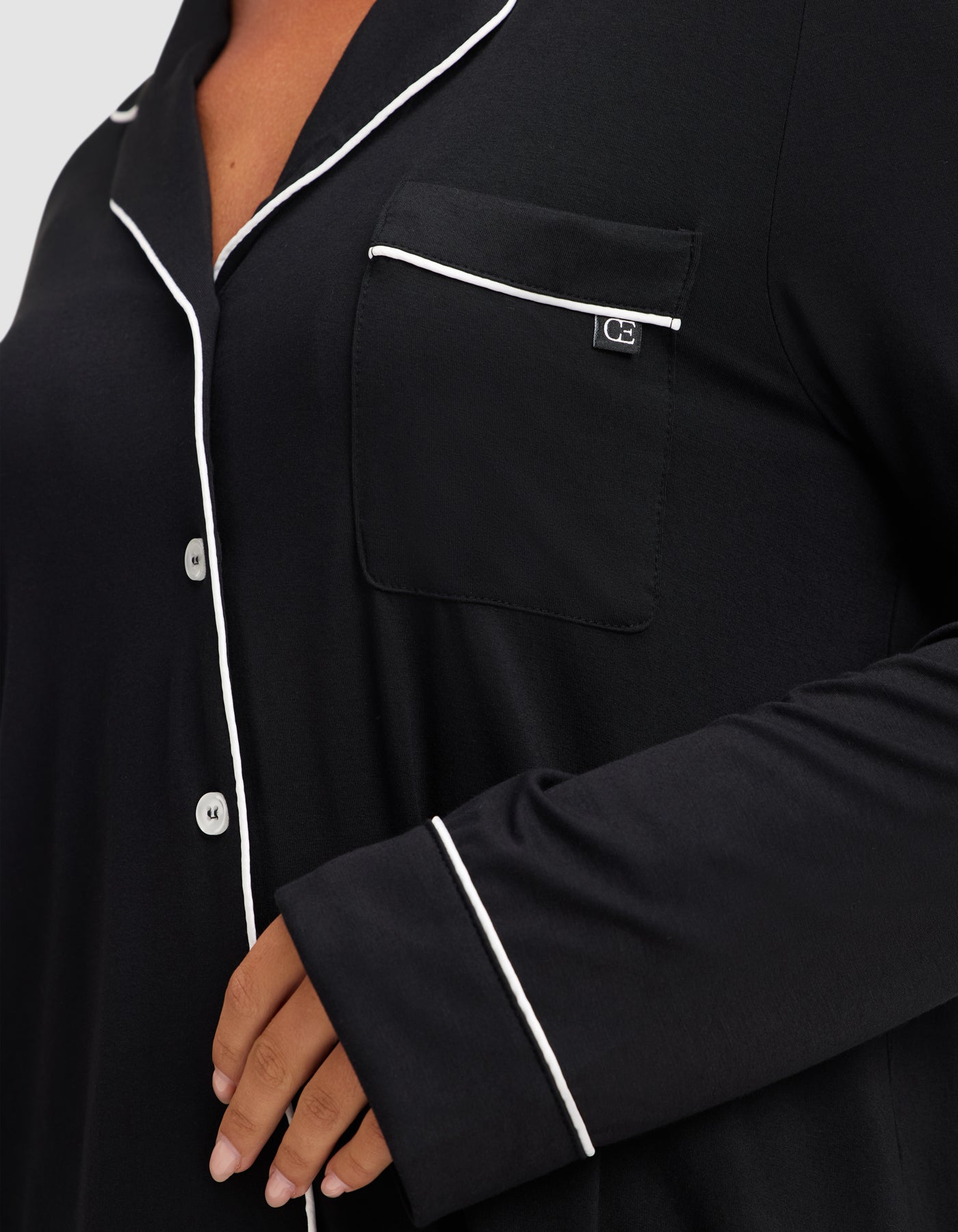 Black@woman wearing black cozy earth pajamas