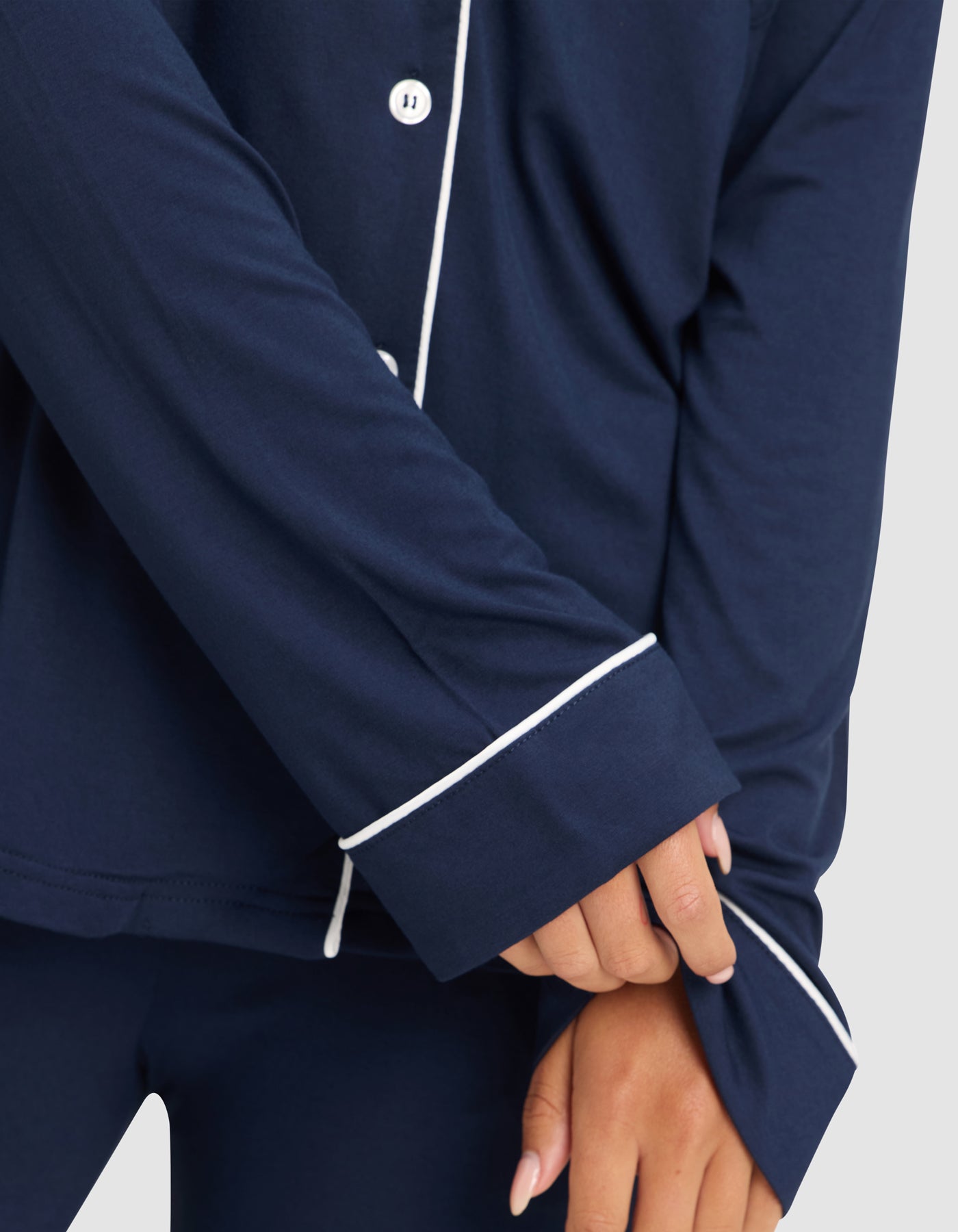 Navy@woman wearing navy cozy earth pajamas