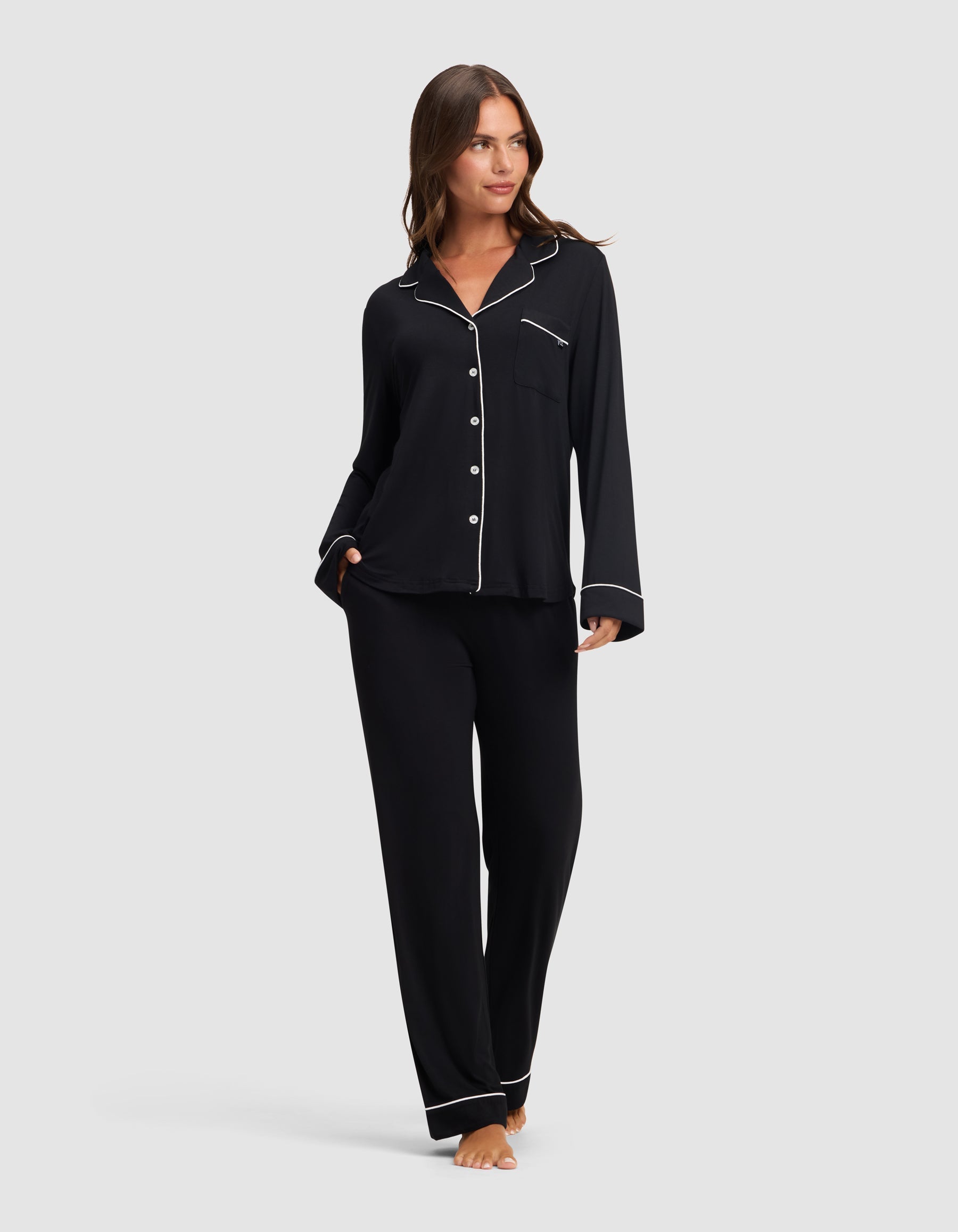 Black@woman wearing black cozy earth pajamas