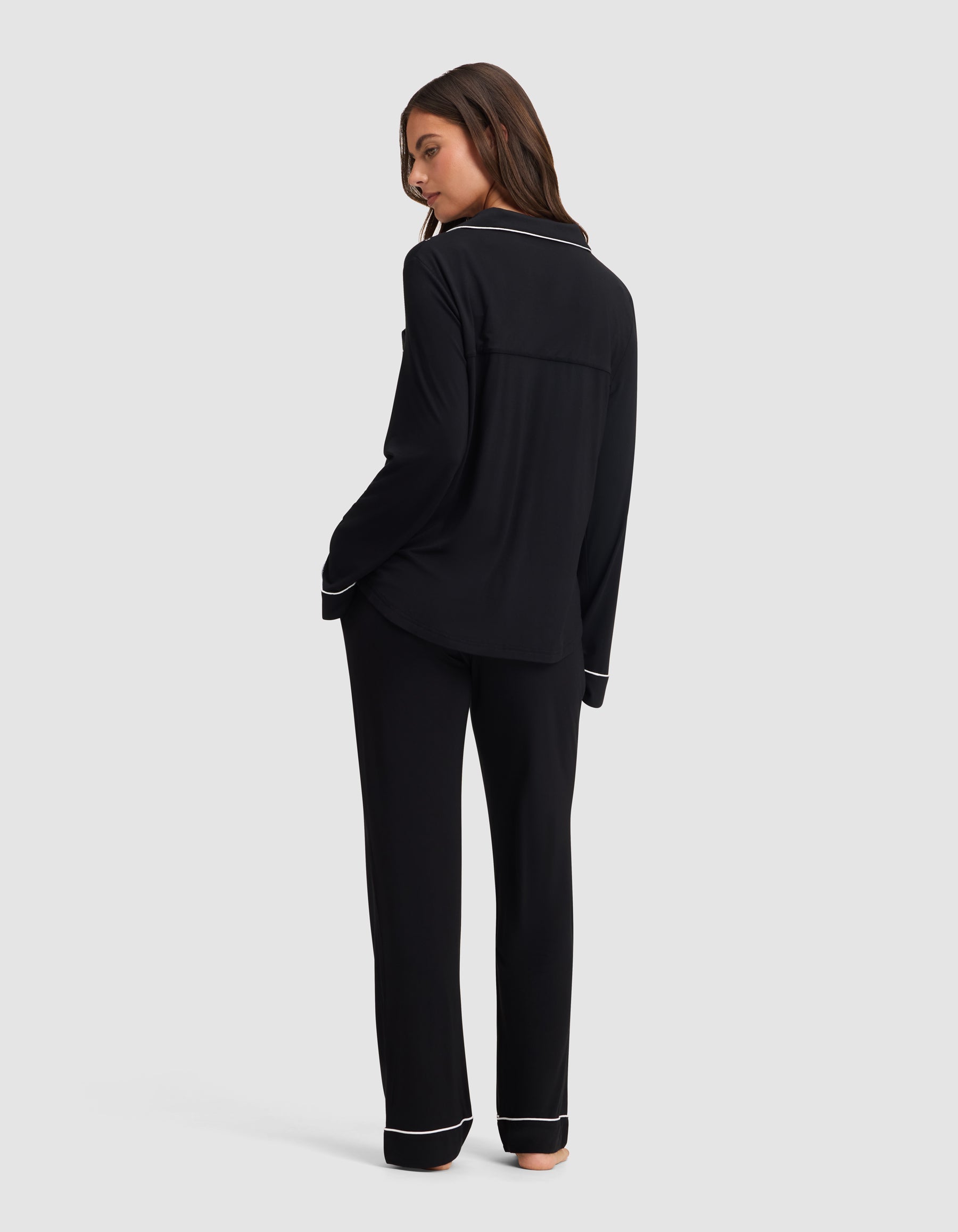 Black@woman wearing black cozy earth pajamas
