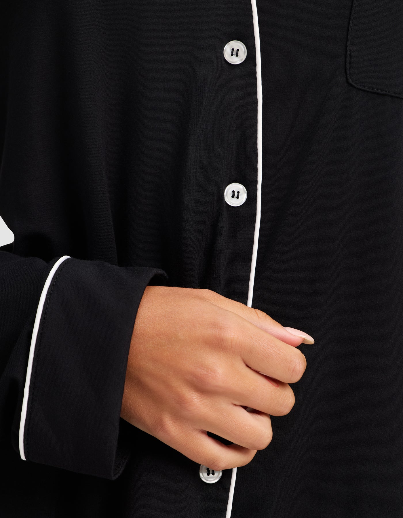 Black@woman wearing black cozy earth pajamas