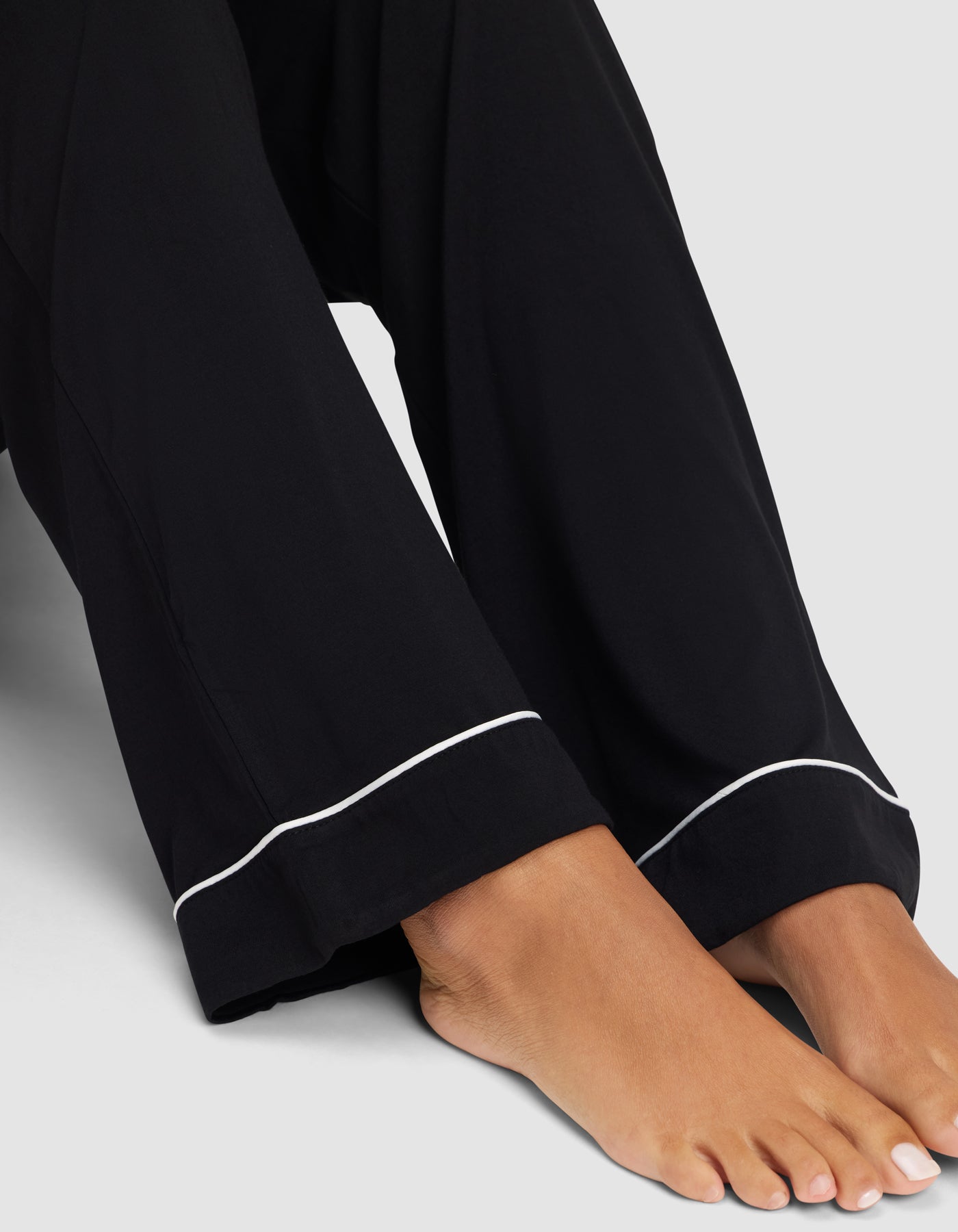 Black@woman wearing black cozy earth pajamas