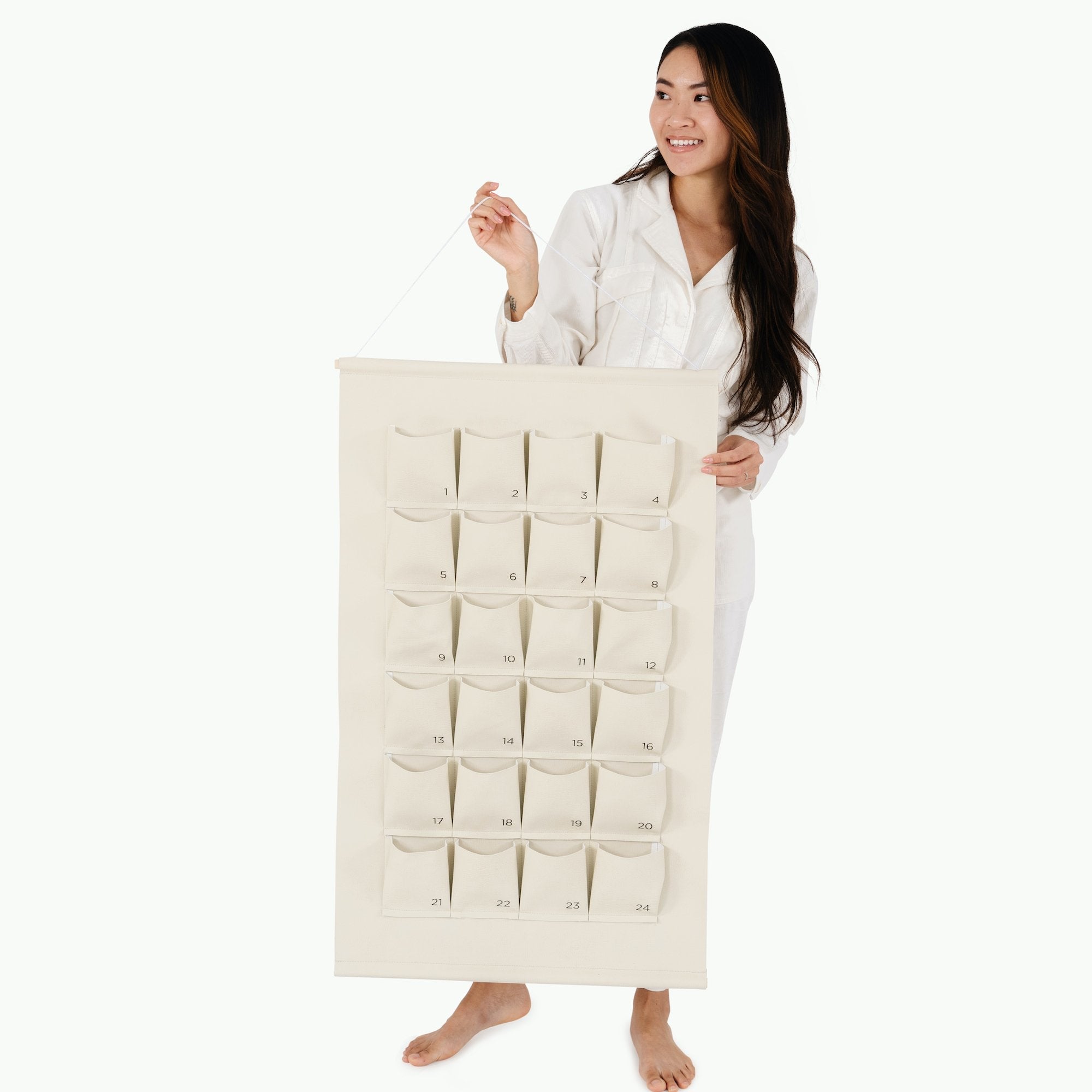 Ivory@Woman holding the Small Ivory Advent Calendar