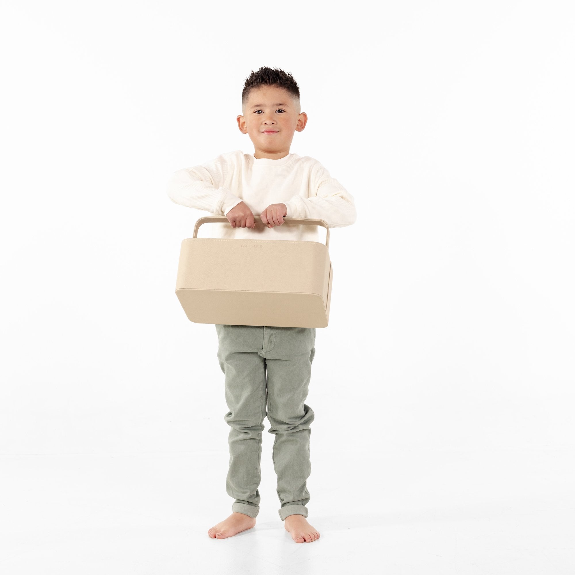 Millet@little kid holding the small millet caddy