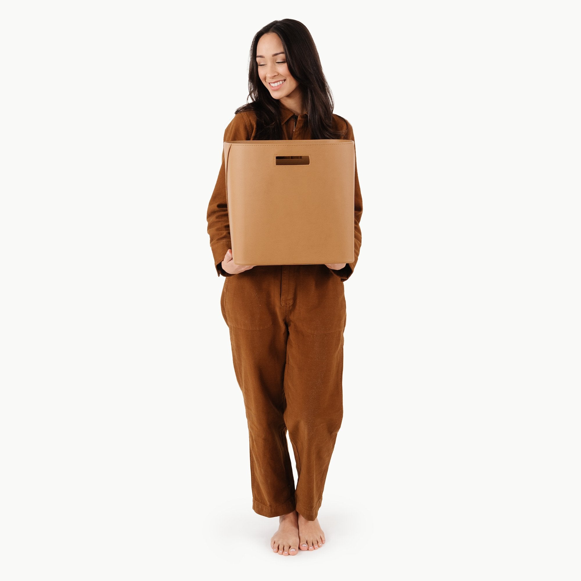 Camel (on sale)@woman holding medium storage bin