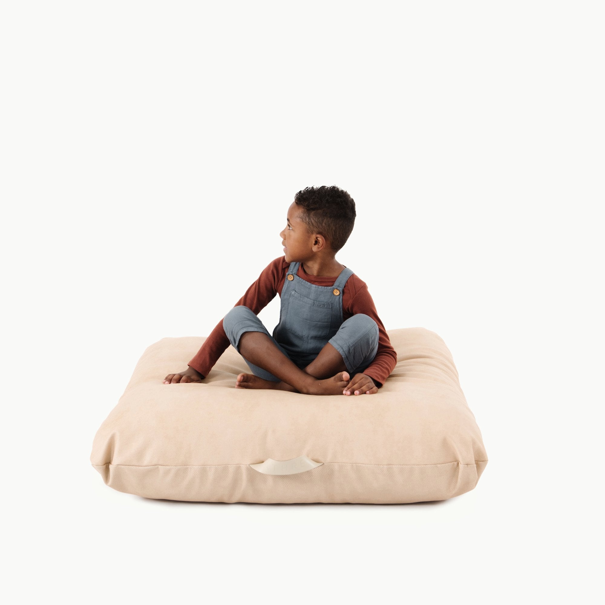 Untanned (on sale) / Square@Kid sitting on the Untanned Square Floor Cushion