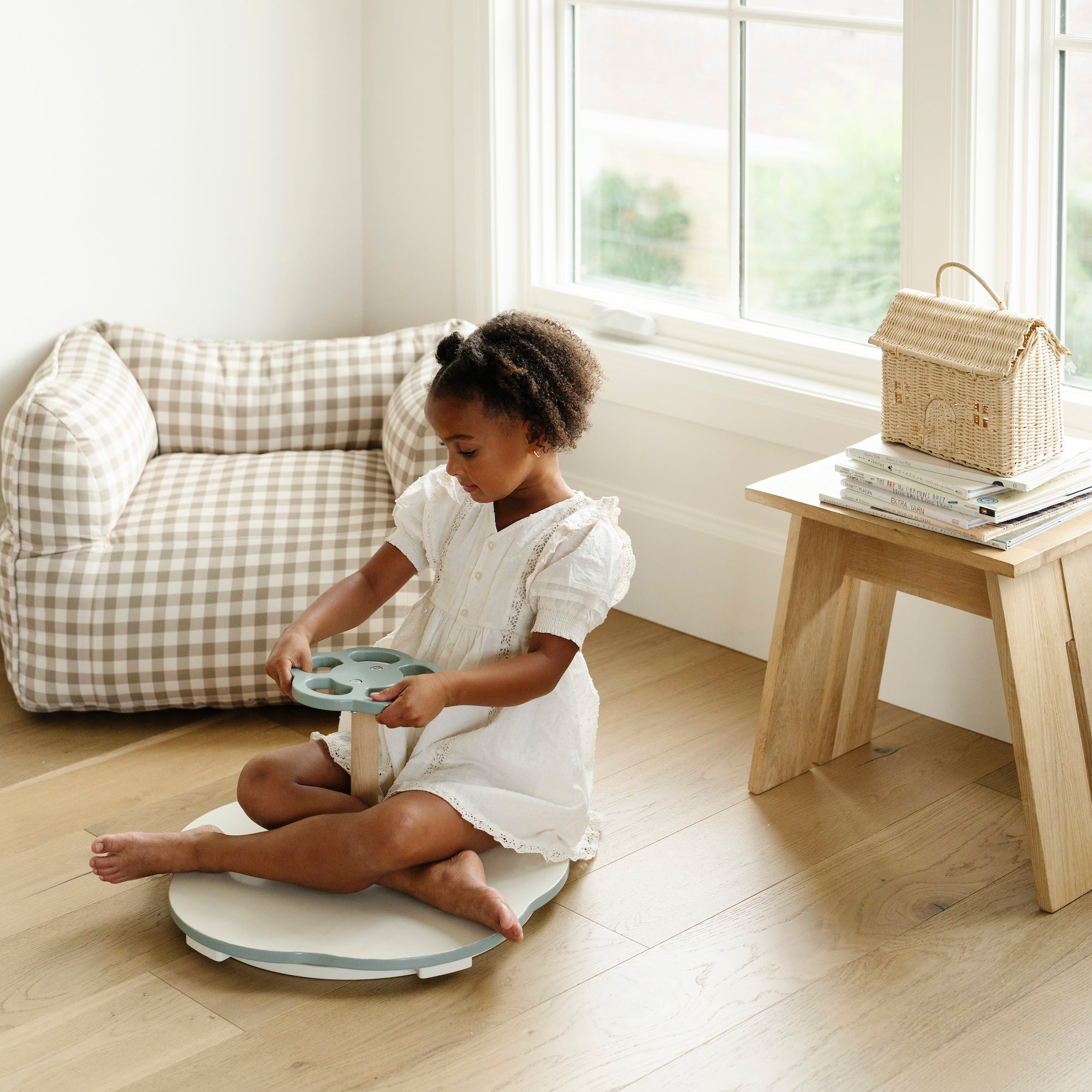 @Toddler using a sit and spin toy to practice balance and coordination