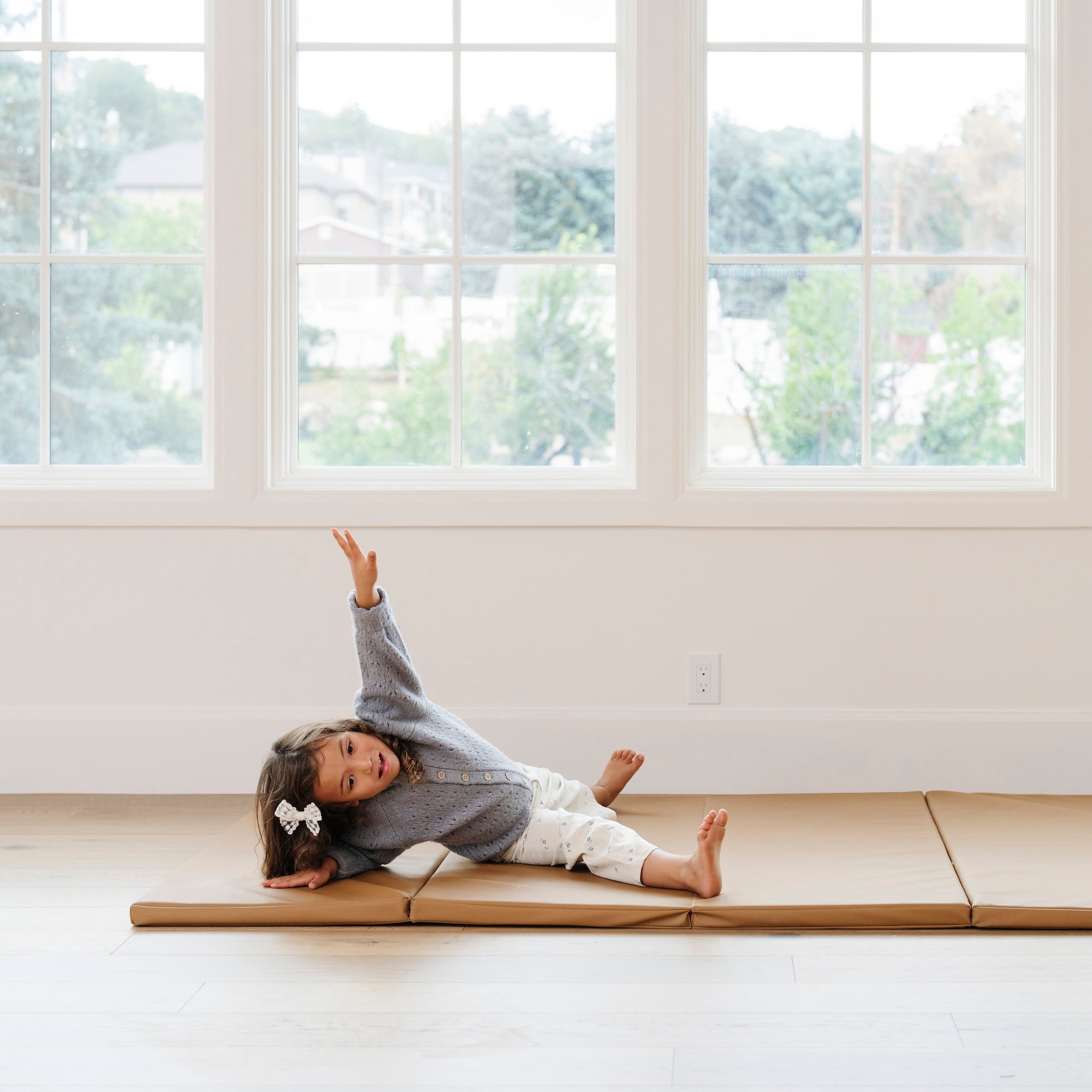 @Child rolling and playing on a comfortable tumbling mat