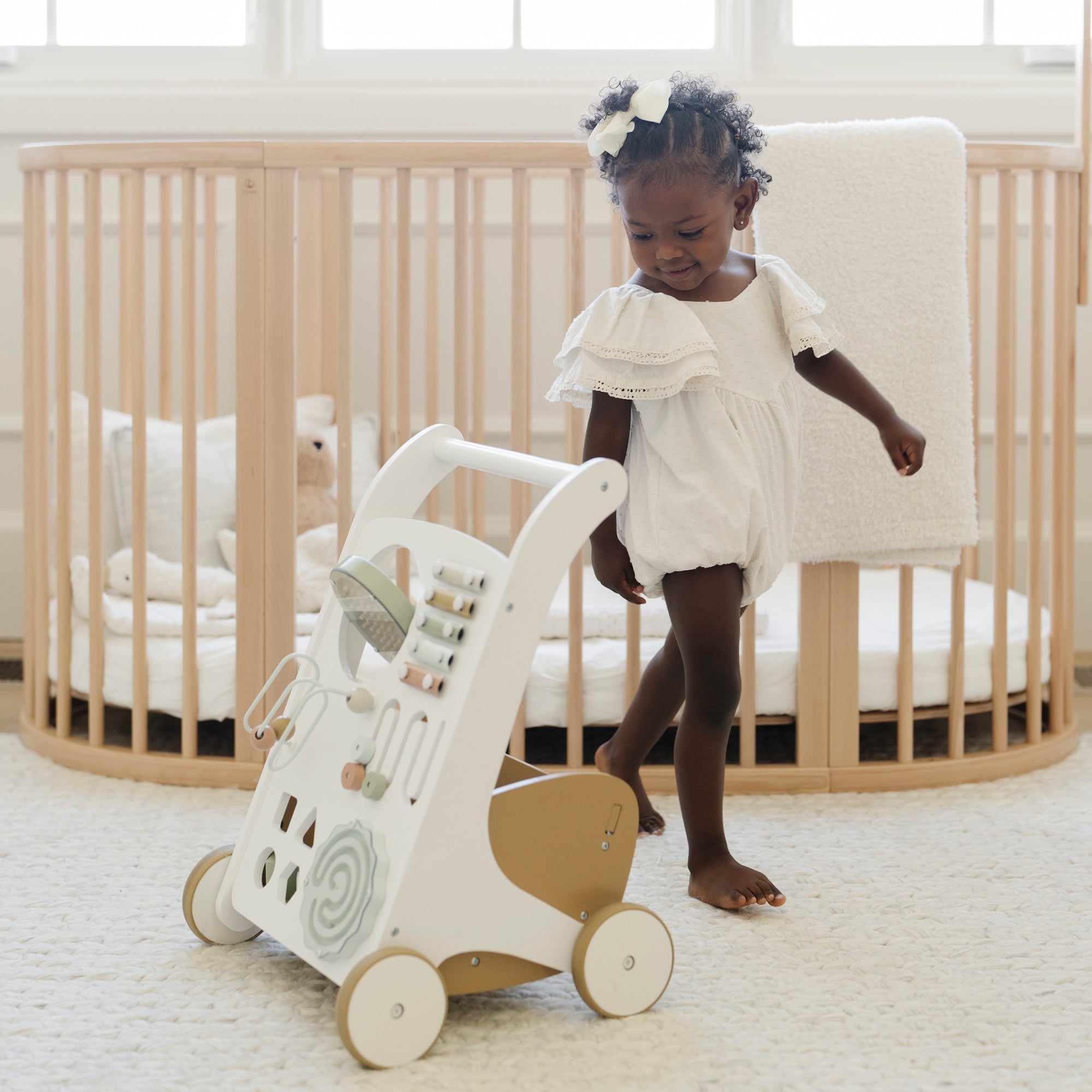 Biscotti (on sale)@little girl playing with activity walker