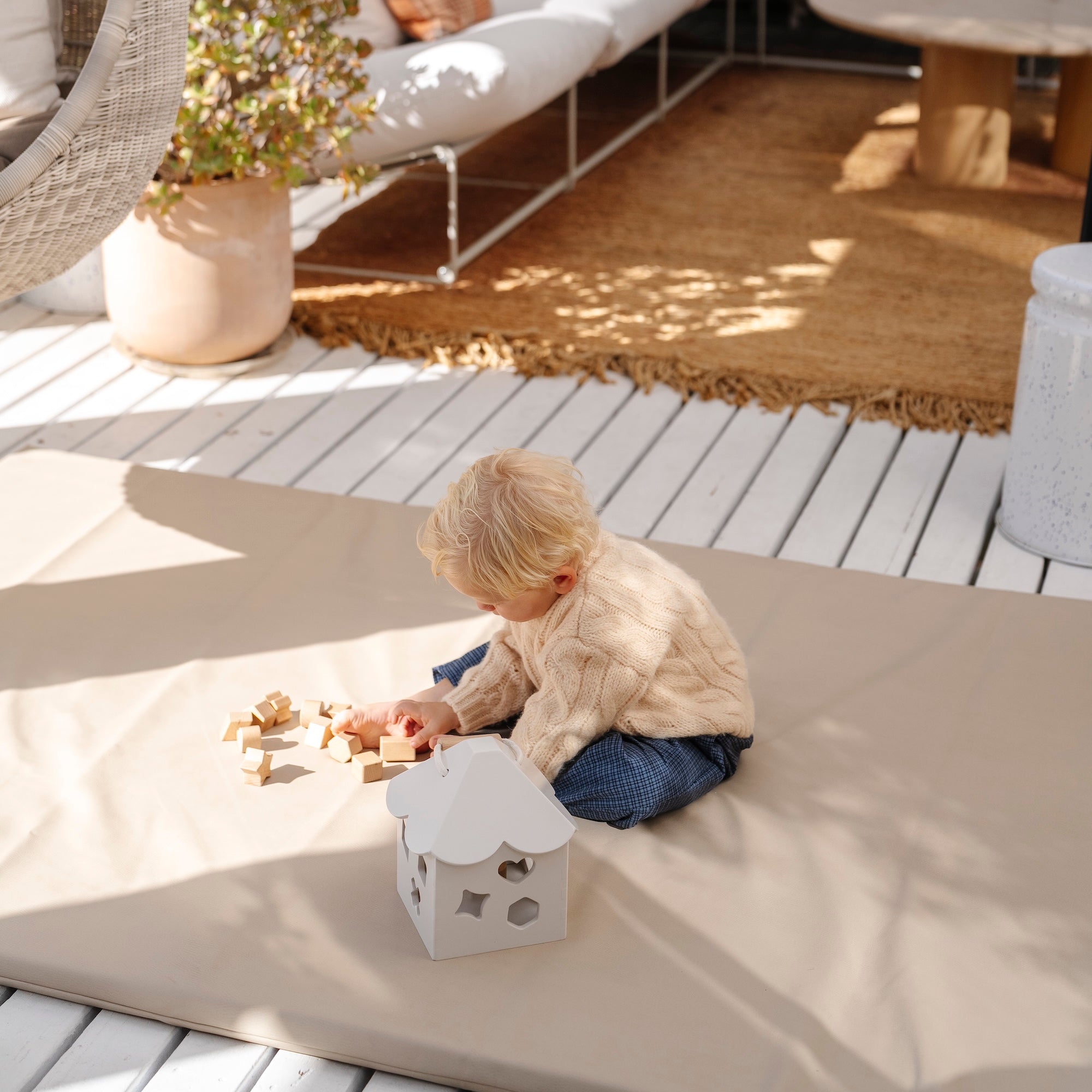 Ivory (on sale)@Baby using a shape sorter to practice fine motor skills