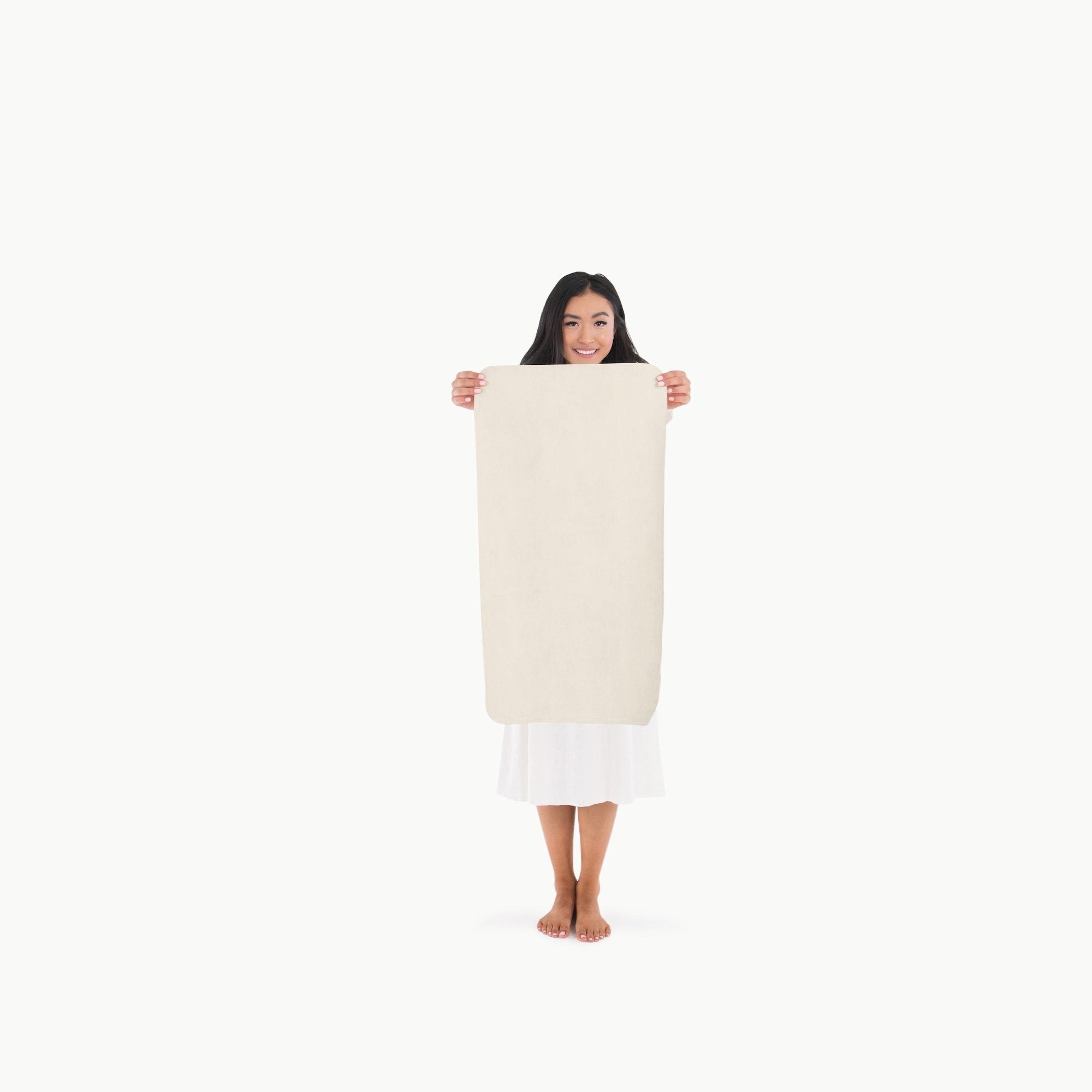 Ivory@Woman holding the Ivory Micro+ Mat