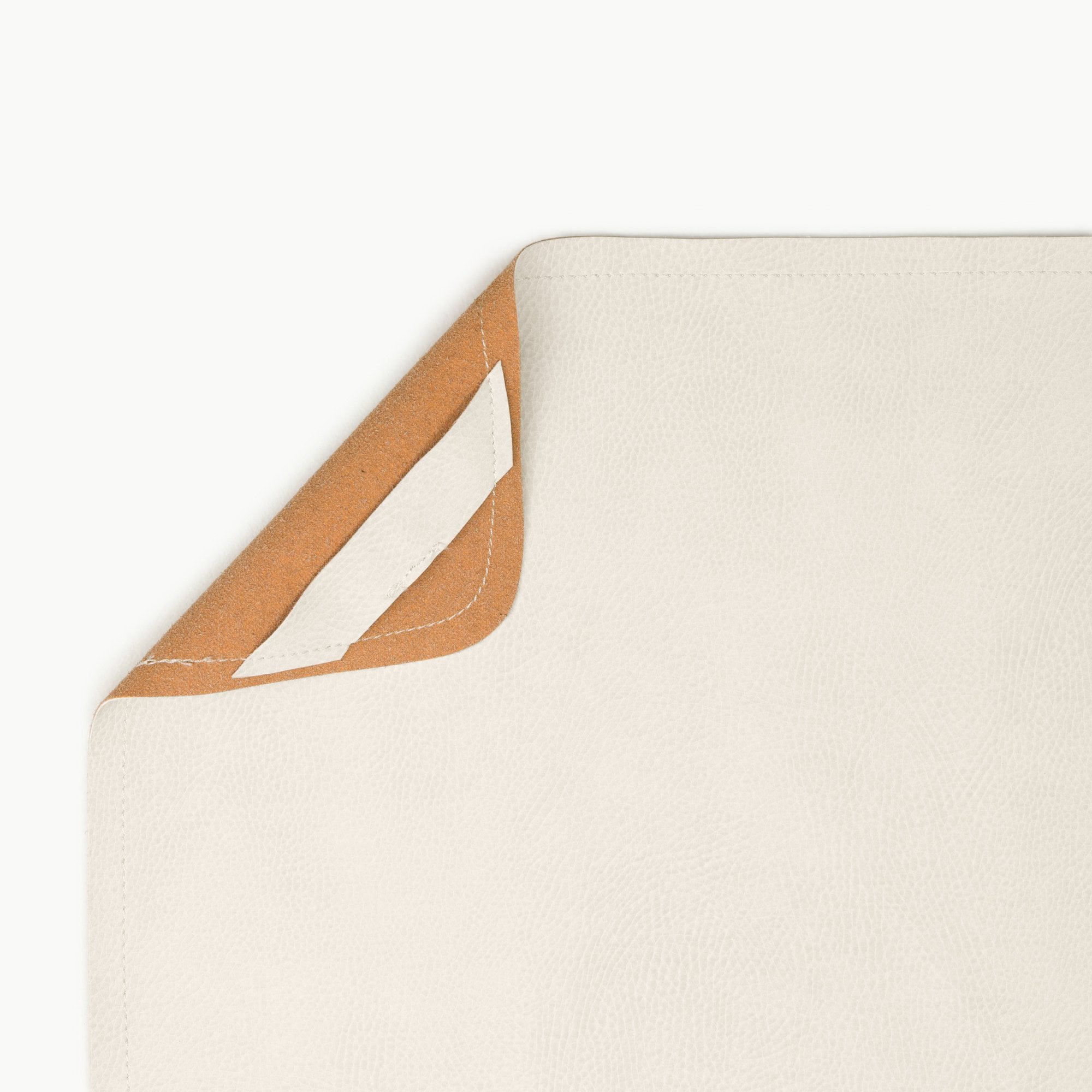 Ivory@Hanging tab detail on the Ivory Mini Mat