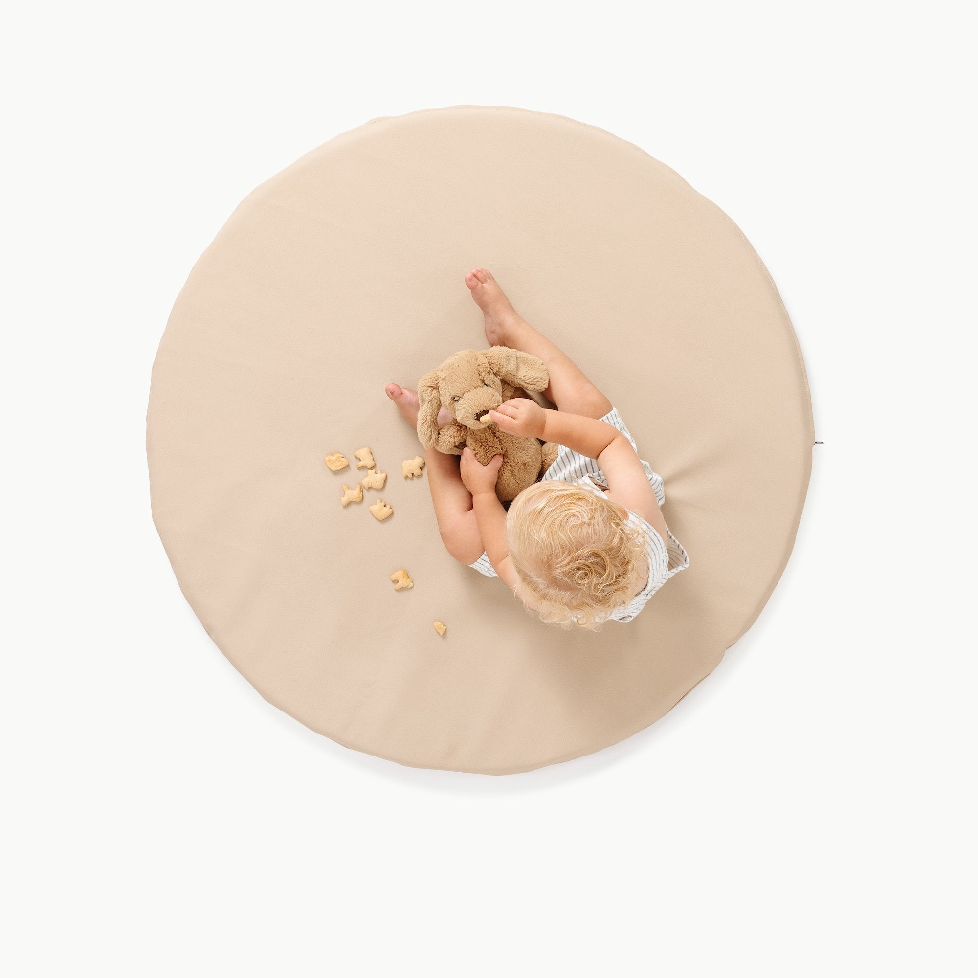 Millet / Circle@overhead of kid playing on the millet padded mini circle