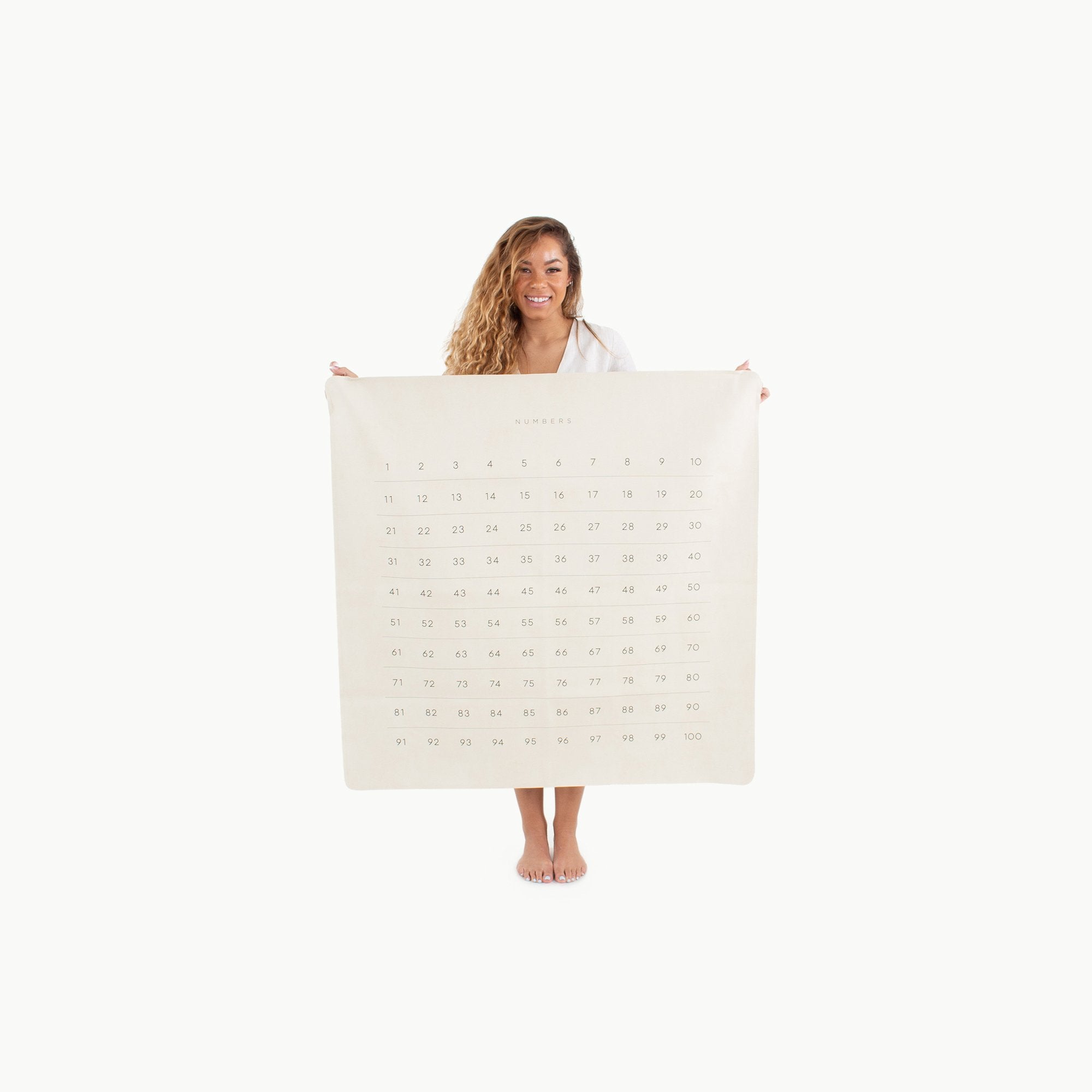Numbers (on sale)@Woman holding the Numbers Mini Mat