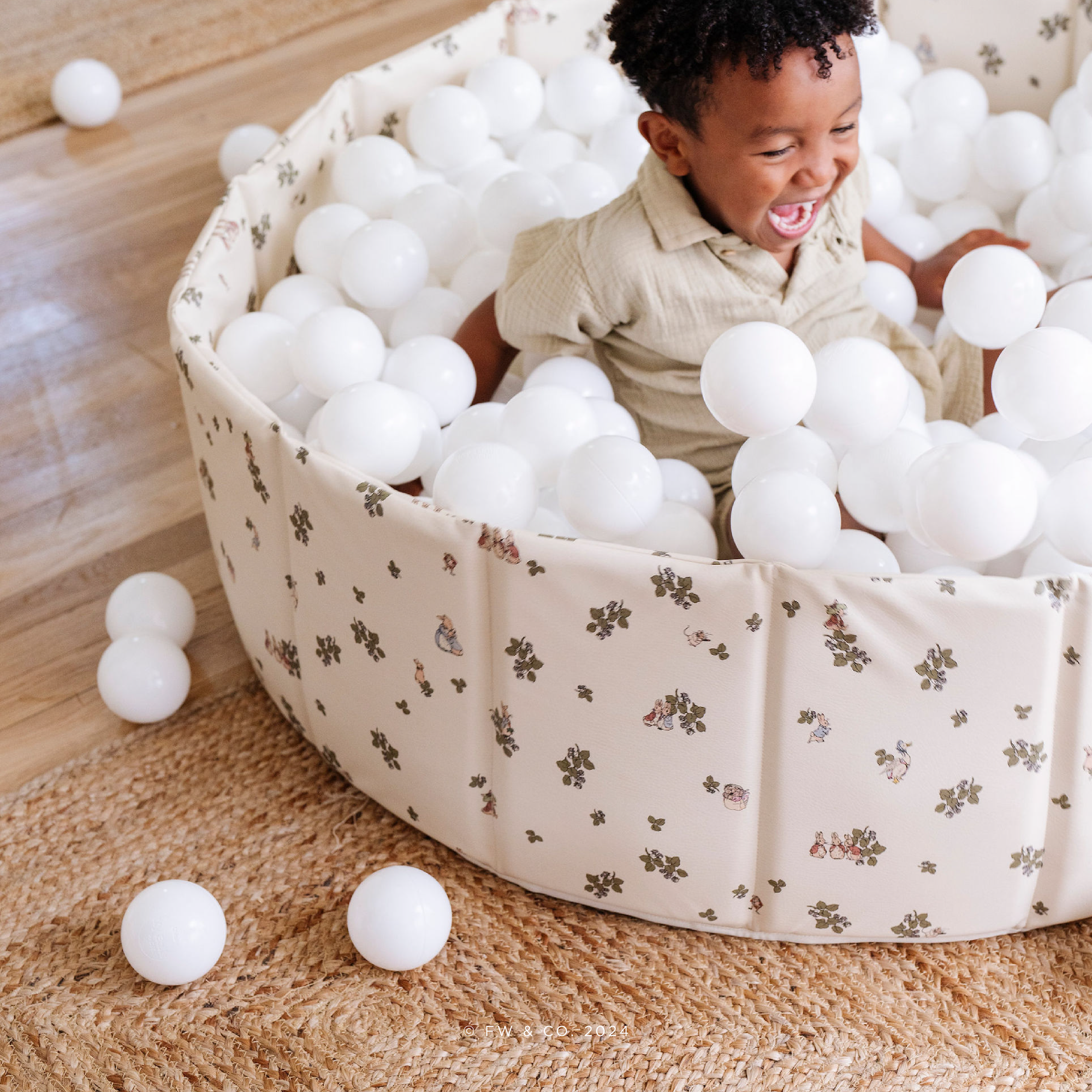 Peter Rabbit™ (on sale)@Modern ball pit styled in a neutral living room for kids’ play