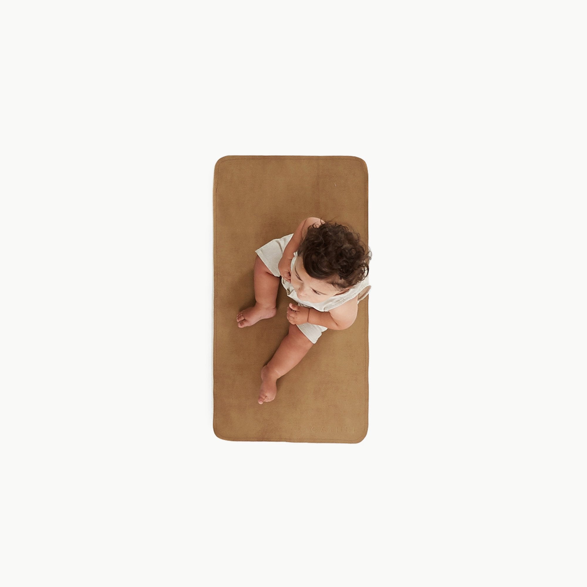 Tannin (on sale)@overhead of baby on the tannin micro+ mat