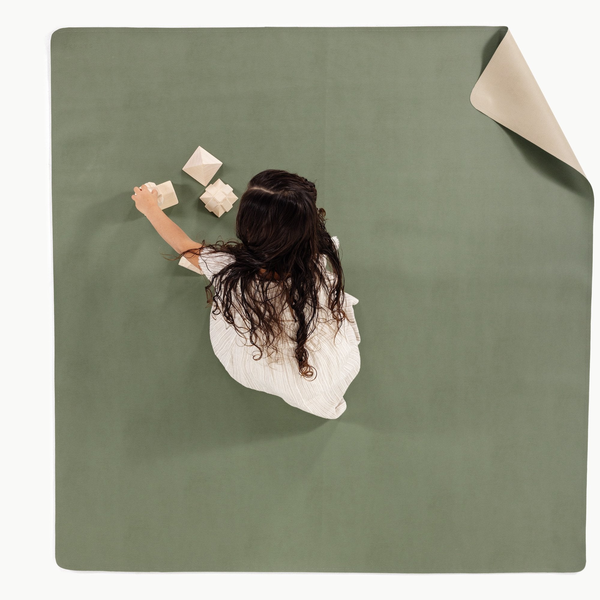 Thyme • Fog (on sale)/ Square@Overhead of kid playing on the Thyme/Fog Midi Square Mat