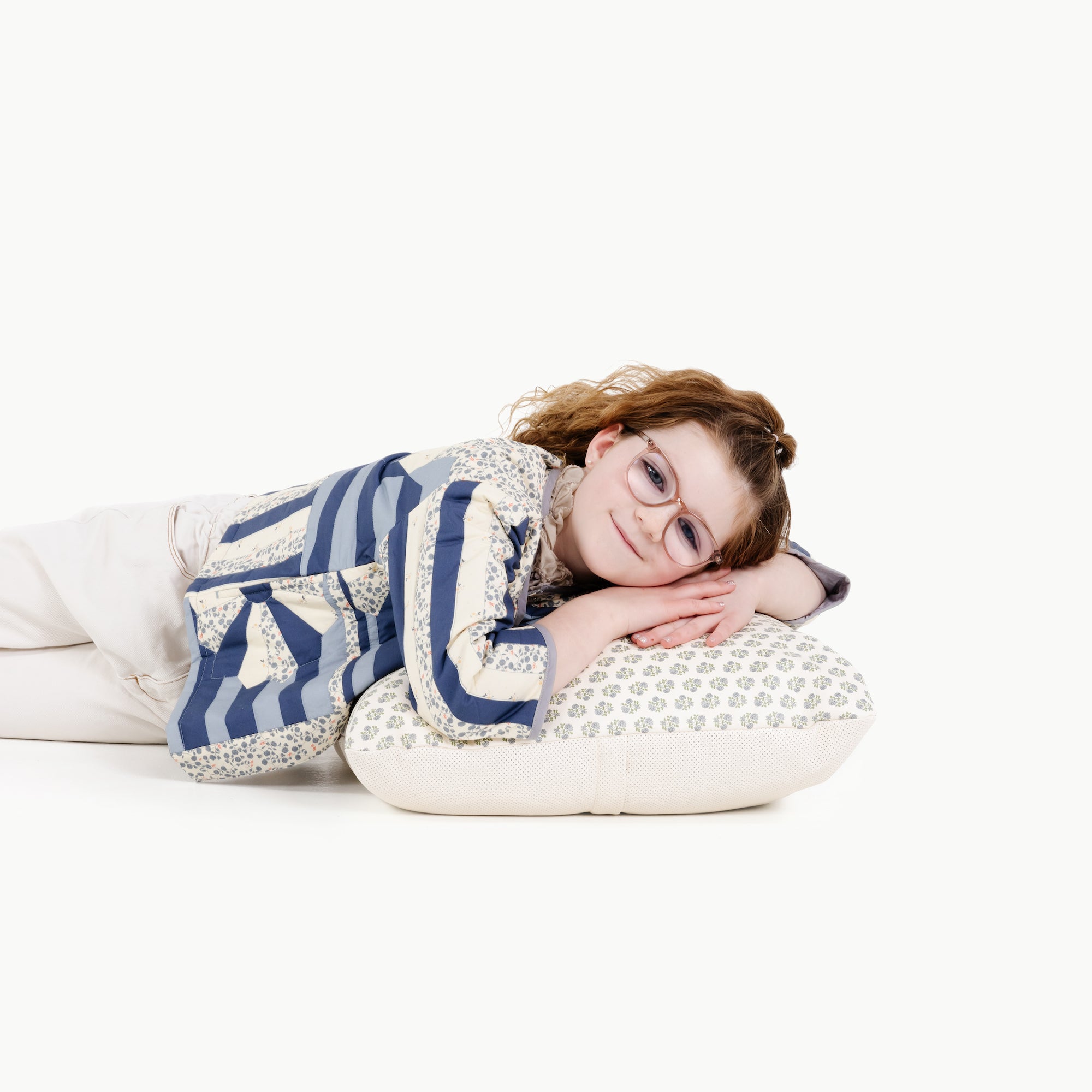 Meadow / Square@kid laying on the meadow square mini floor cushion