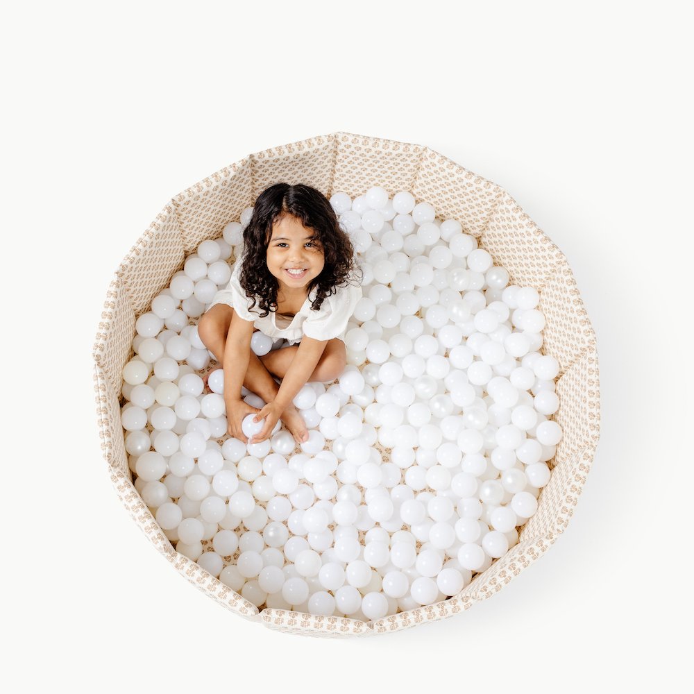 Bloom (on sale)@Child playing in a soft ball pit designed for babies and toddlers