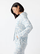Sky Toile@woman wearing sky toile cozy earth pajamas
