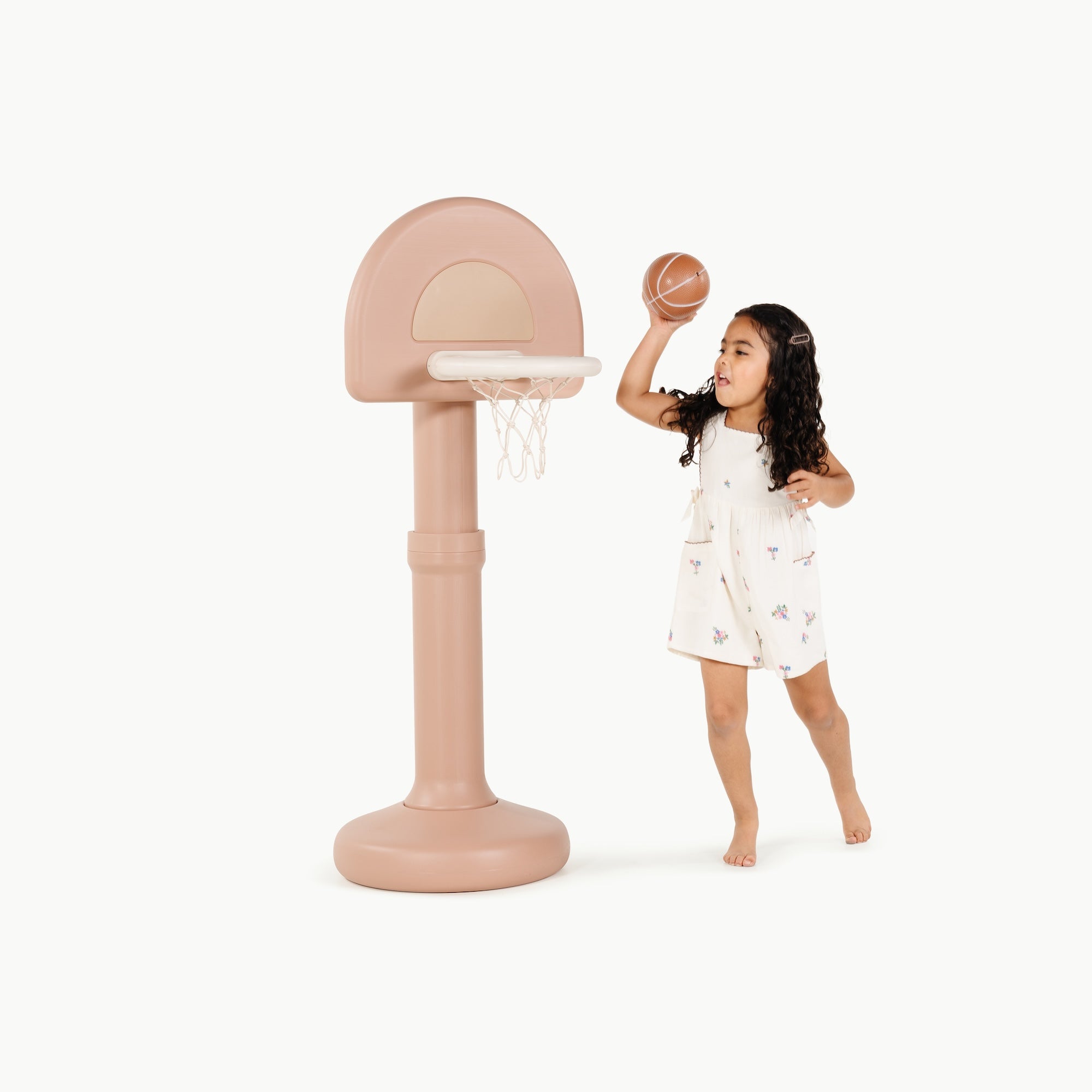 Tulle@Toddler using a basketball hoop to practice coordination and movement