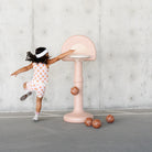 Tulle@Toddler using a basketball hoop to practice coordination and movement