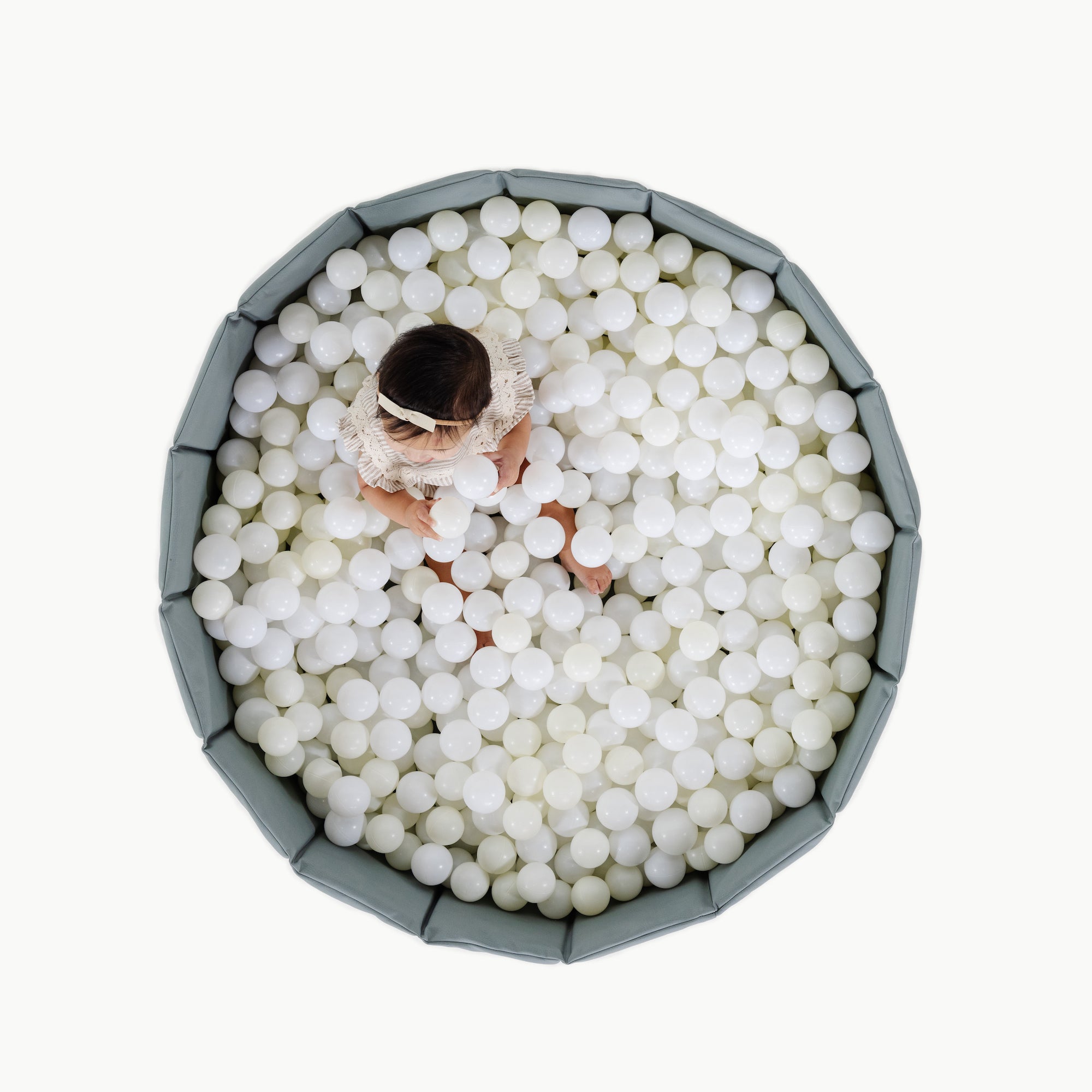 Amalfi (on sale)@Child playing in a soft ball pit designed for babies and toddlers