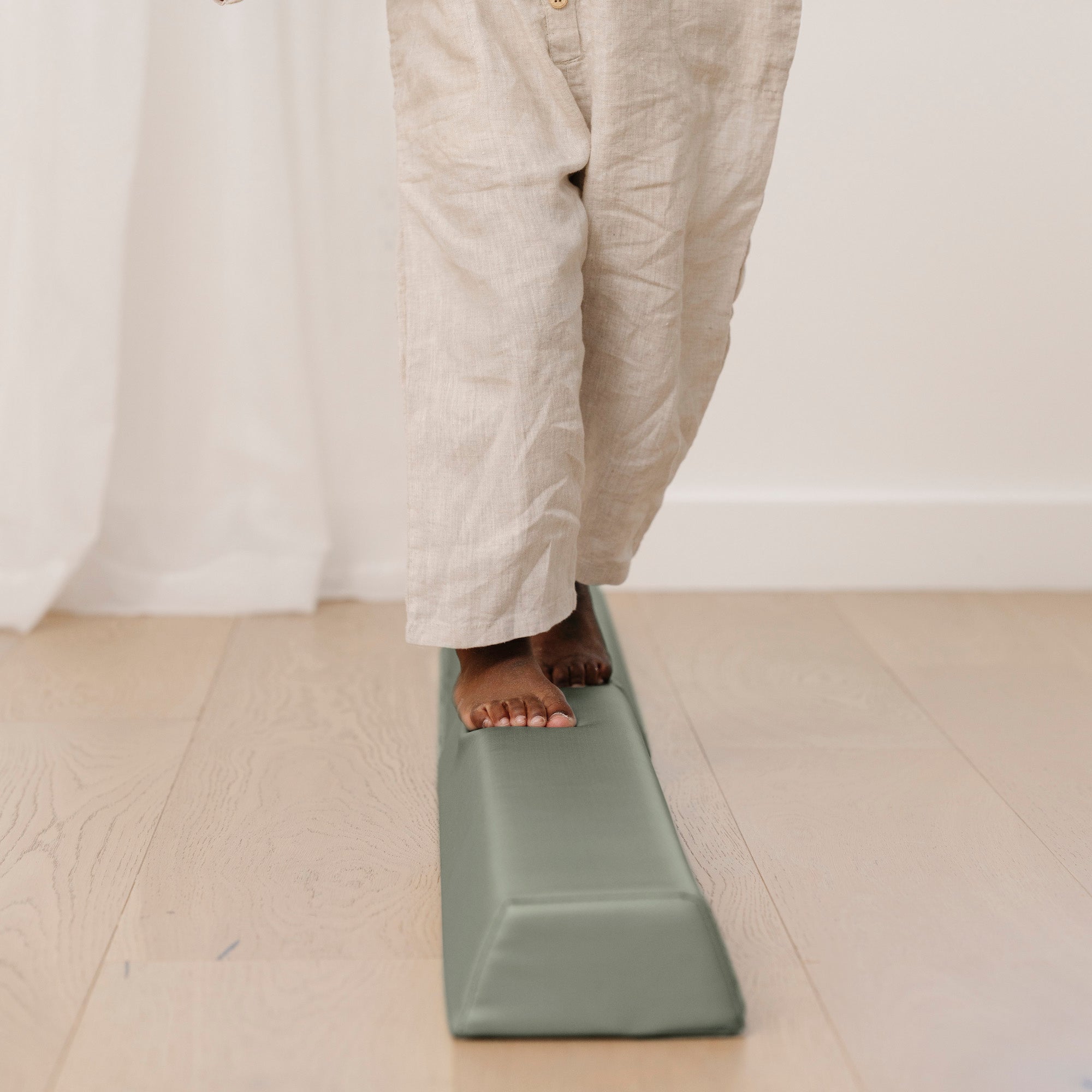 Seagrass (on sale)@close up of kids toes walking across the rollic by gathre balance beam