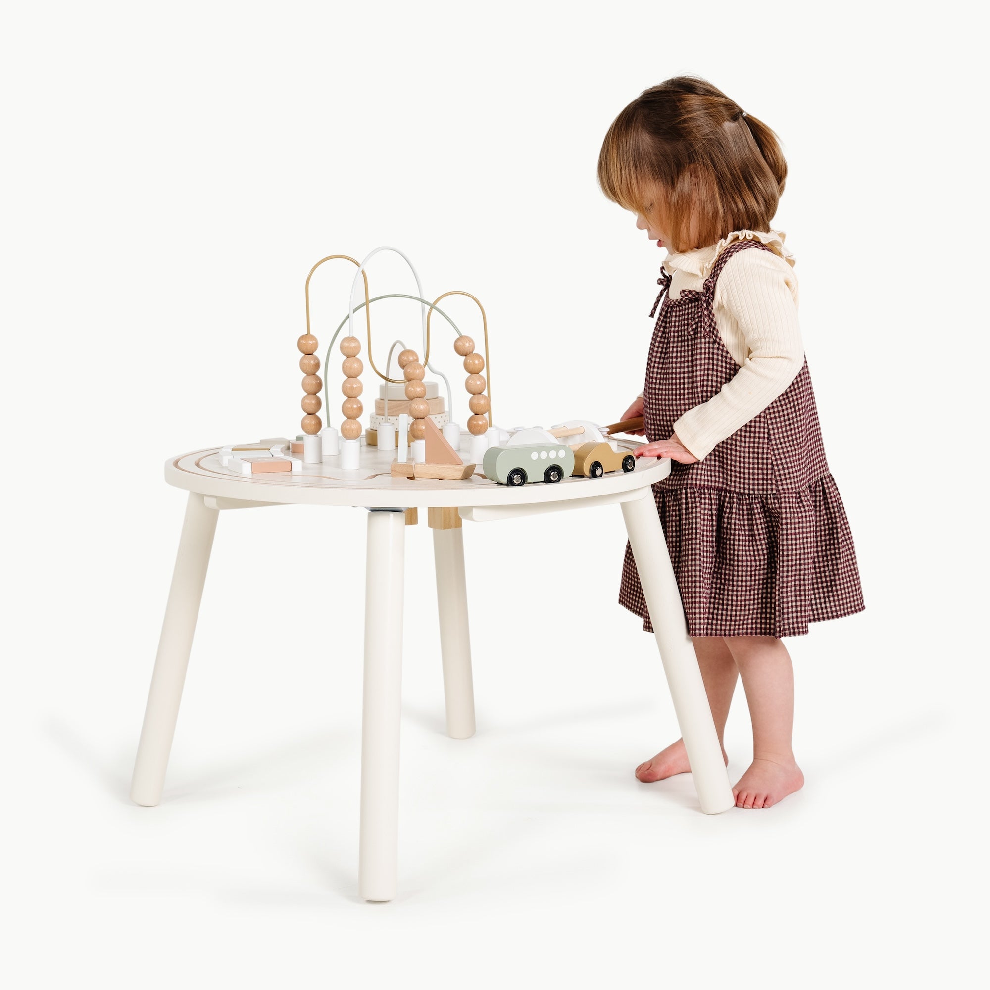 Biscotti (on sale)@Child using an activity table for hands-on creative play