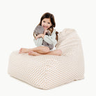 Bloom (on sale)@kid sitting on the bloom lounger