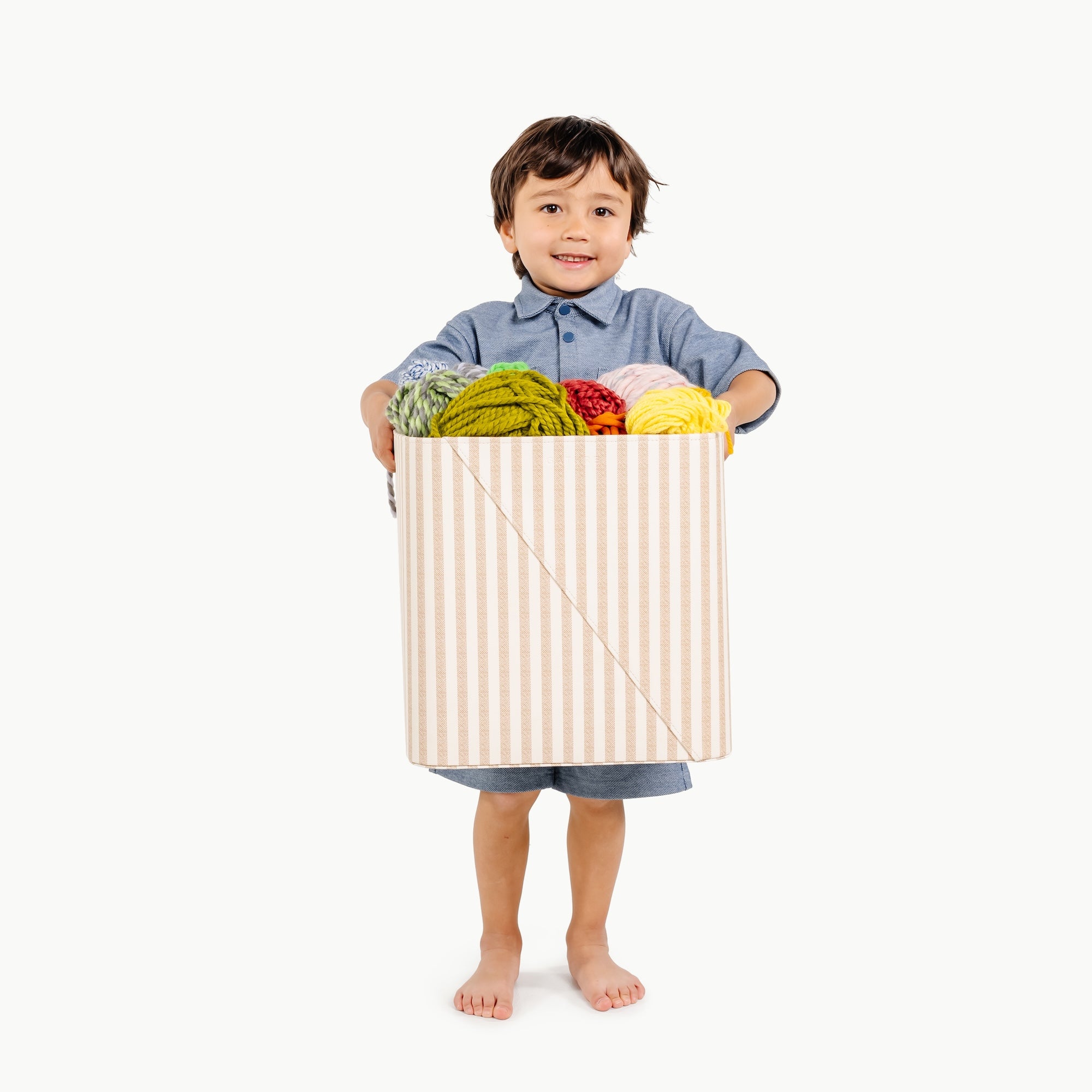 Cafe Stripe (on sale)@boy holding medium storage bin