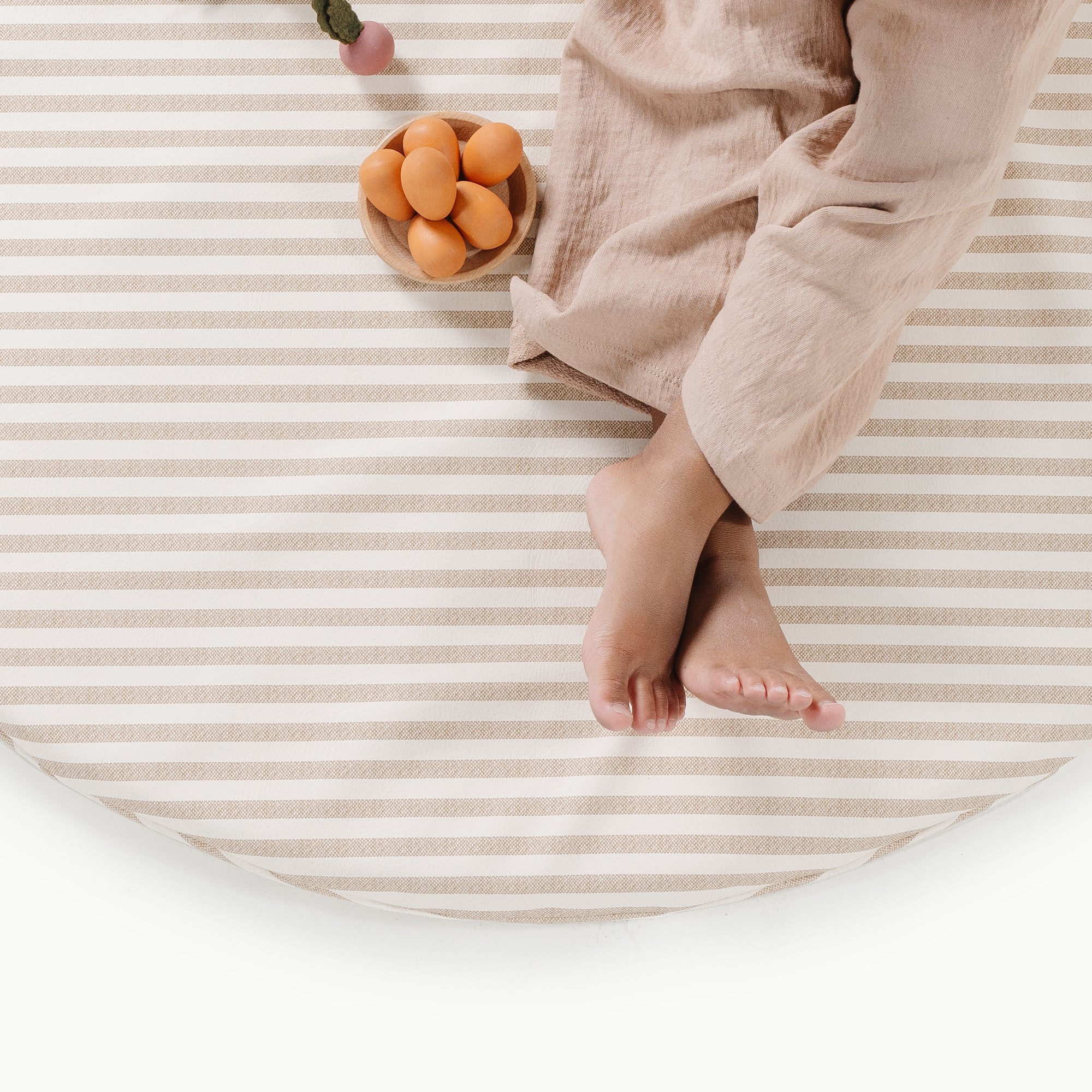 Cafe Stripe / Circle@overhead of kid playing on the cafe stripe padded mini circle