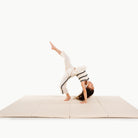 Cafe Stripe@Child rolling and playing on a comfortable tumbling mat