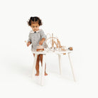 Camel (on sale)@Child using an activity table for hands-on creative play