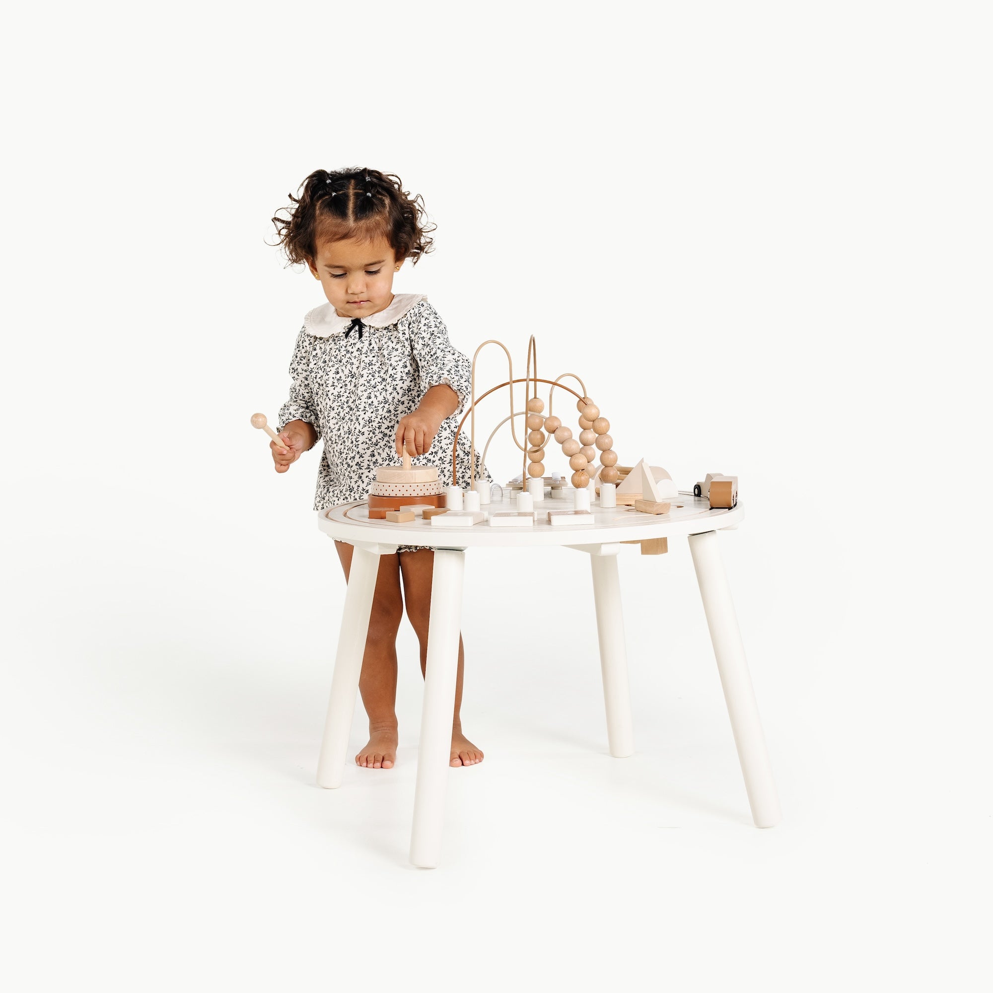Camel (on sale)@Child using an activity table for hands-on creative play