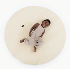 Blanc (on sale)@overhead of kid playing on the blanc padded midi circle